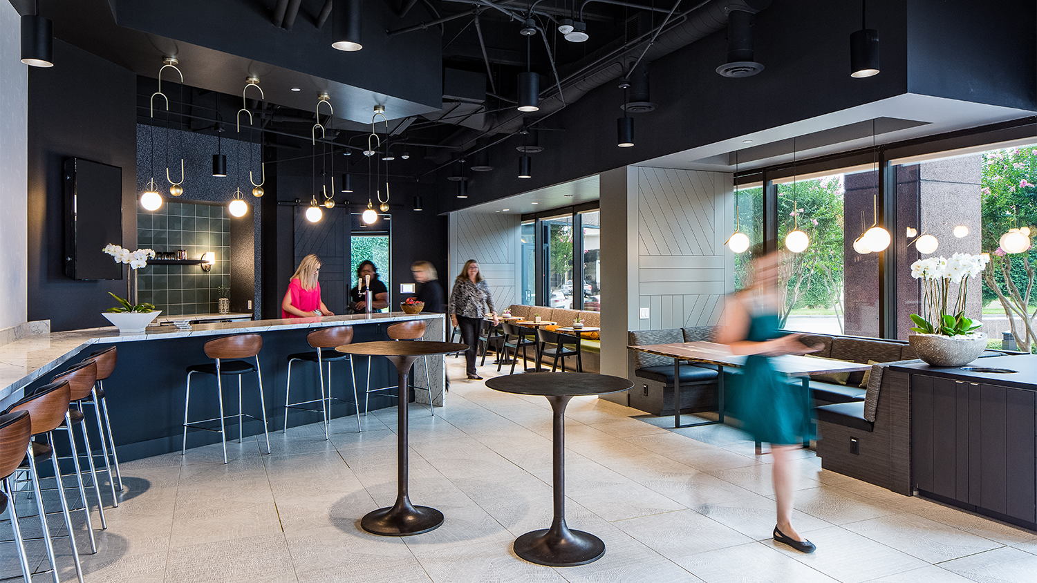 1800 West Loop Servery Common Area with Bar and People Sitting 2