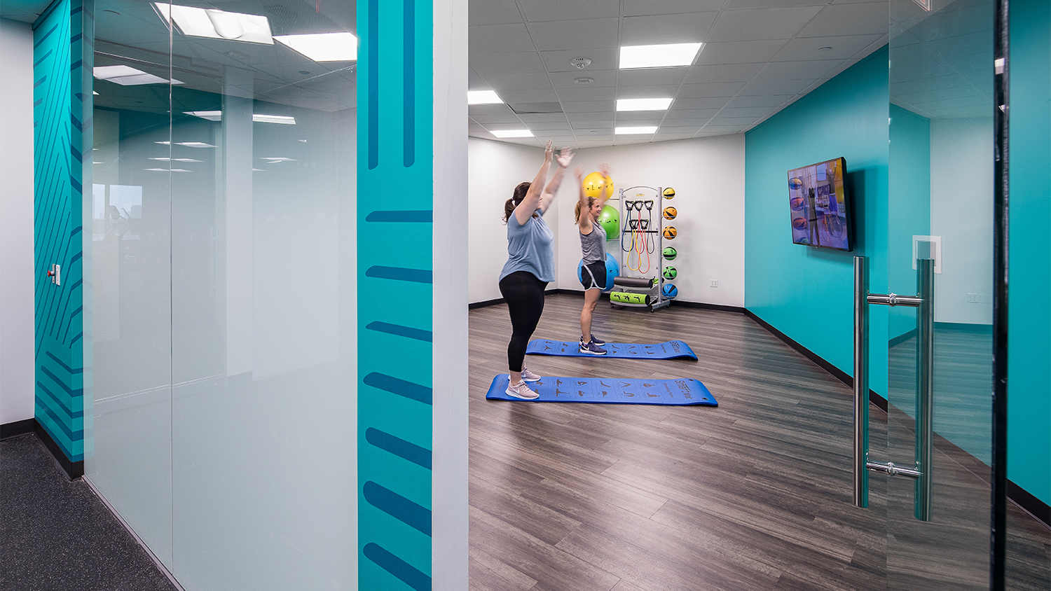 1800 West Loop Fitness Center with people doing yoga