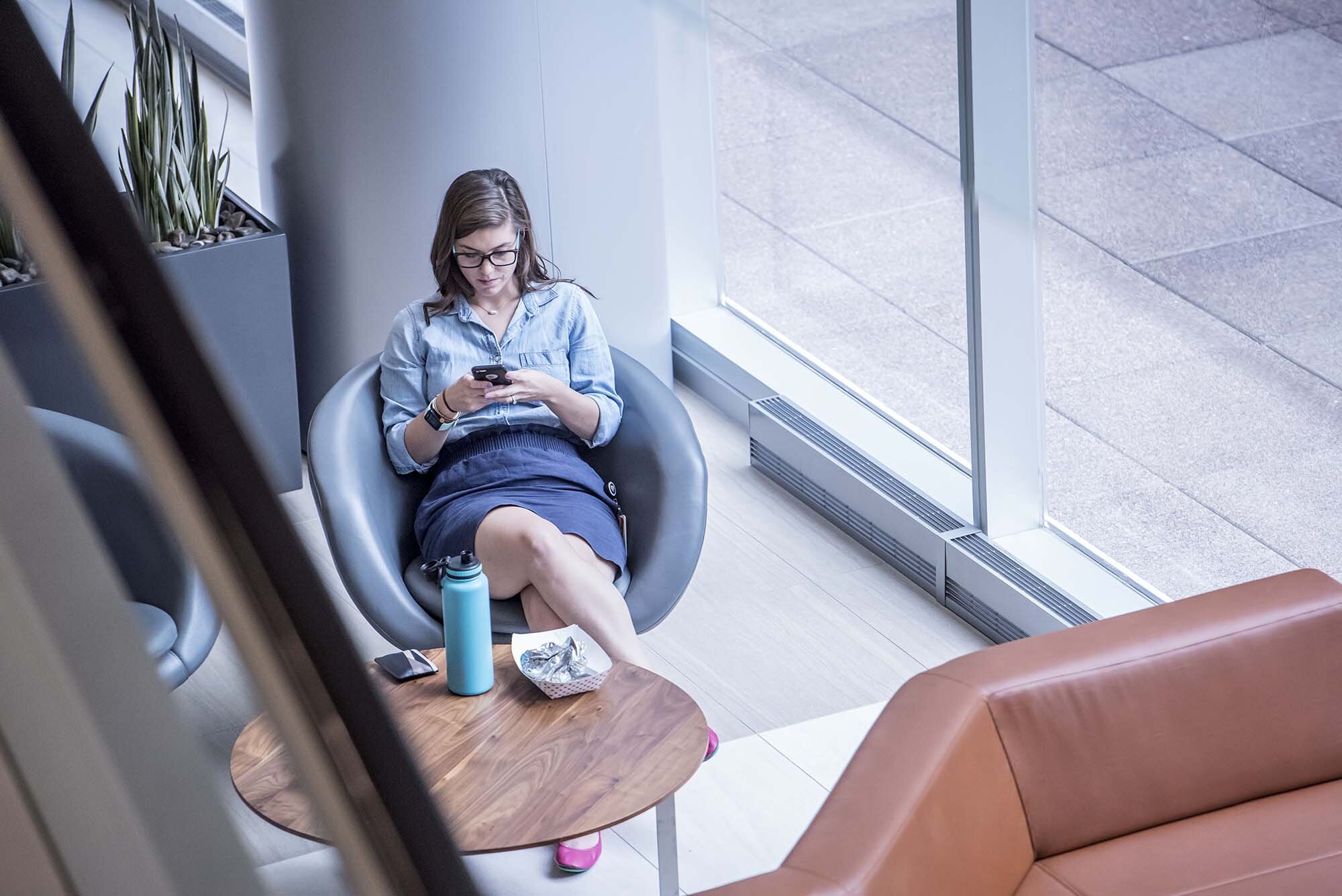 Columbia Plaza Lobby closeup of businesswoman relaxing in chair