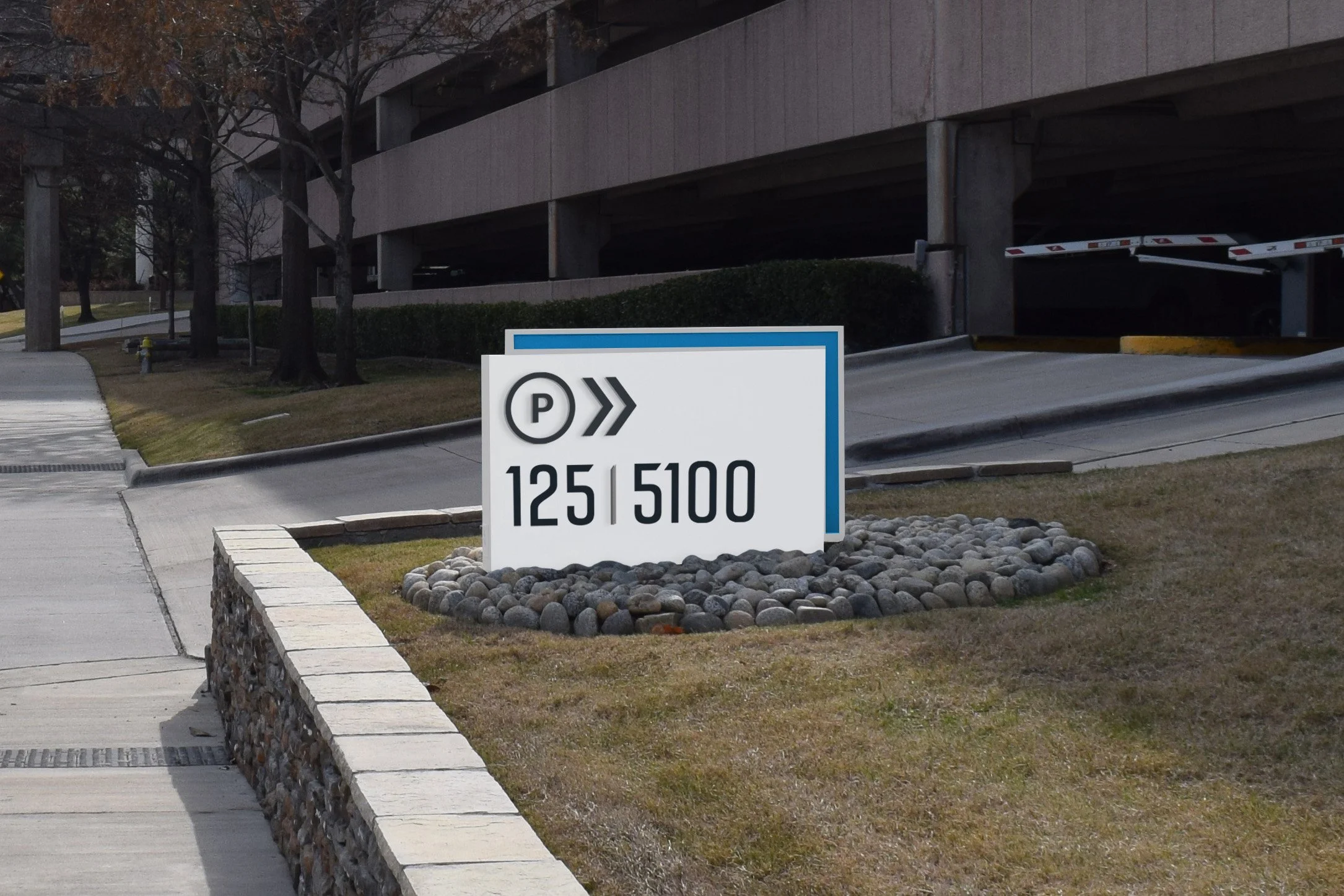 Directional parking signage for both 125 and 5100 properties.
