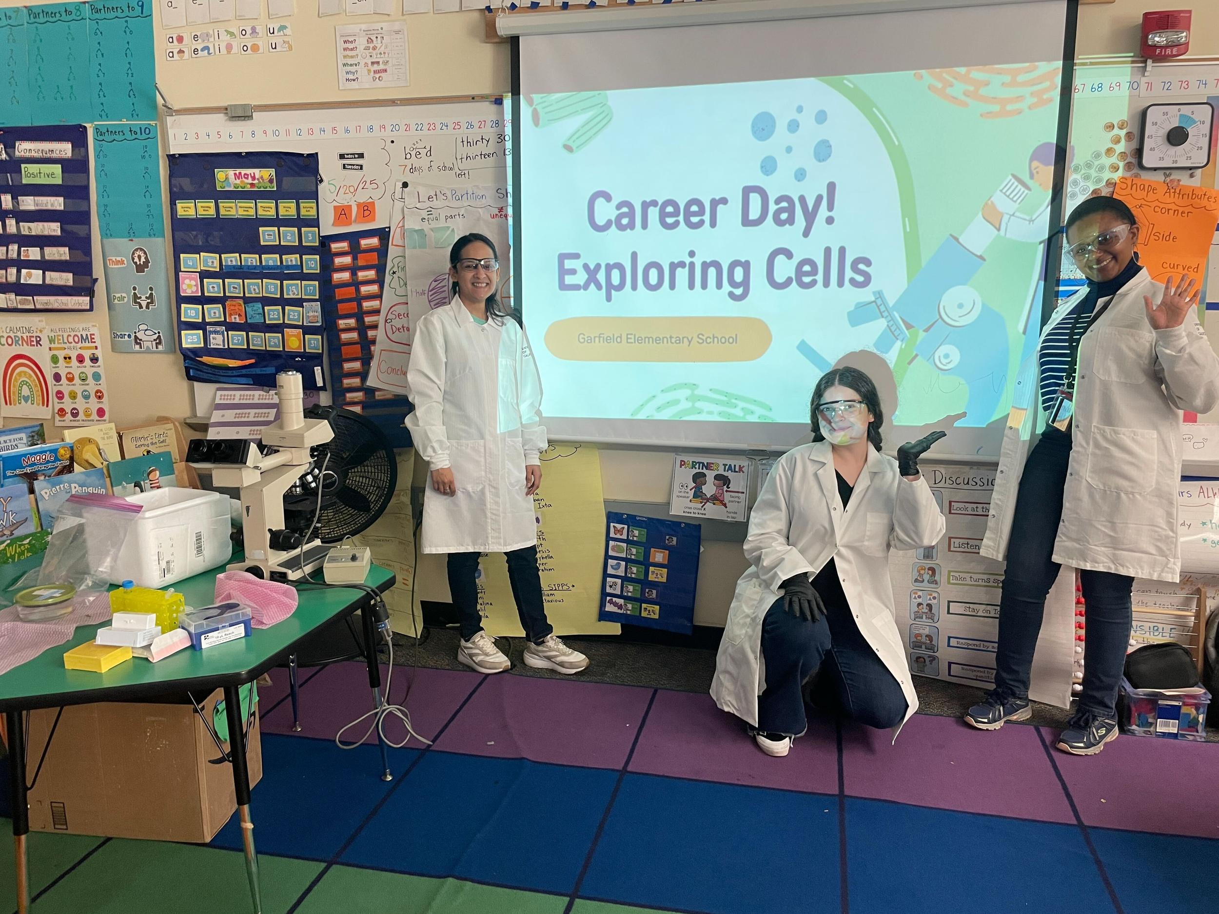Tejashree, Camryn, and Casadora represent the Lewis Lab at local elementary schools