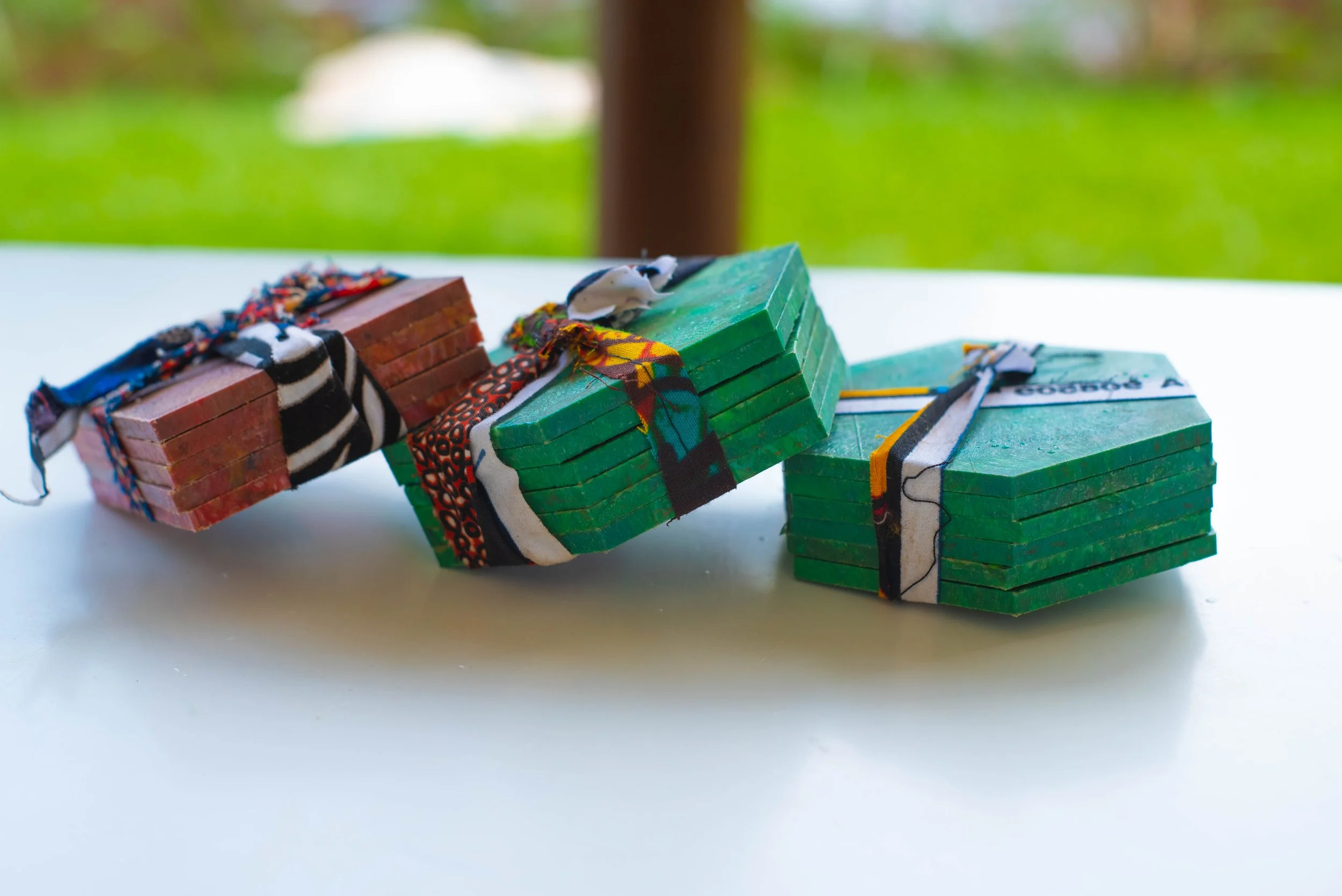 TakaCoasters not only offer protection for your surfaces but also a unique opportunity to personalize your space. Made entirely from recycled plastics, these coasters are available in two shapes, hexagon and circle, and can be customized with text an