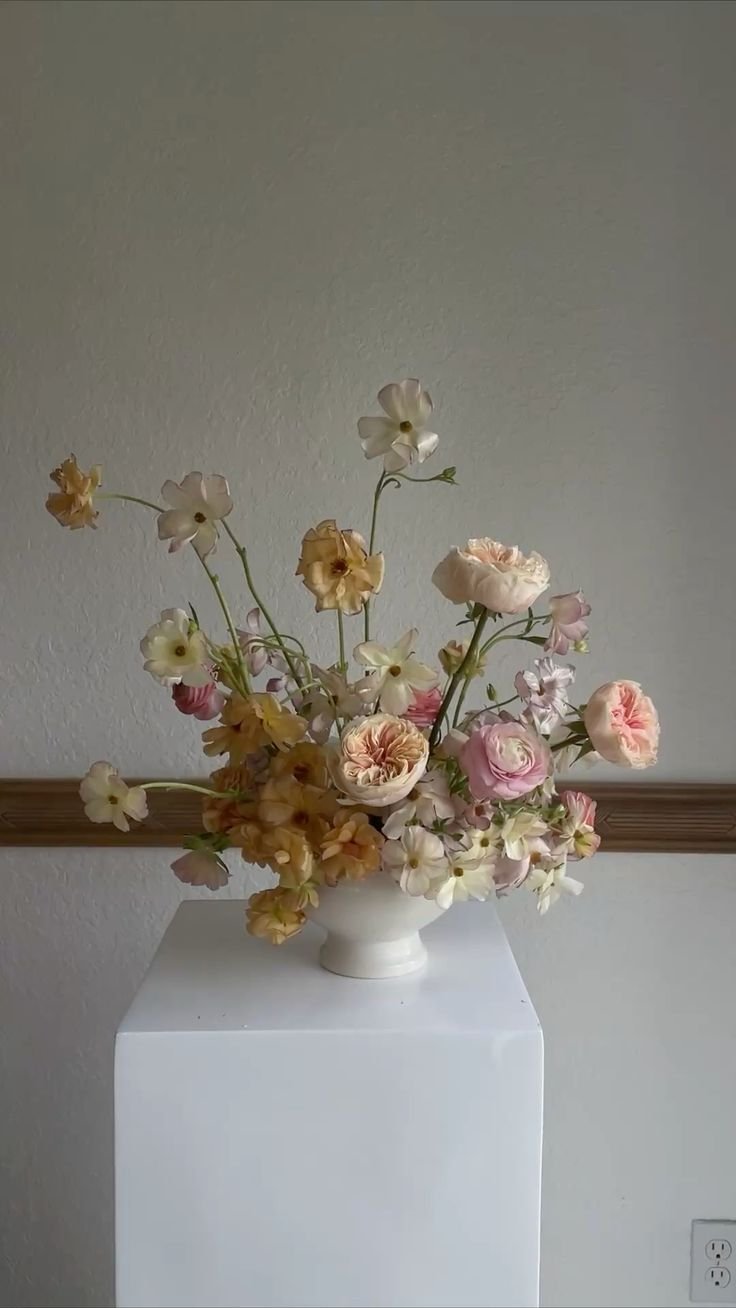 Butterfly ranunculus with a touch of garden roses.jpg