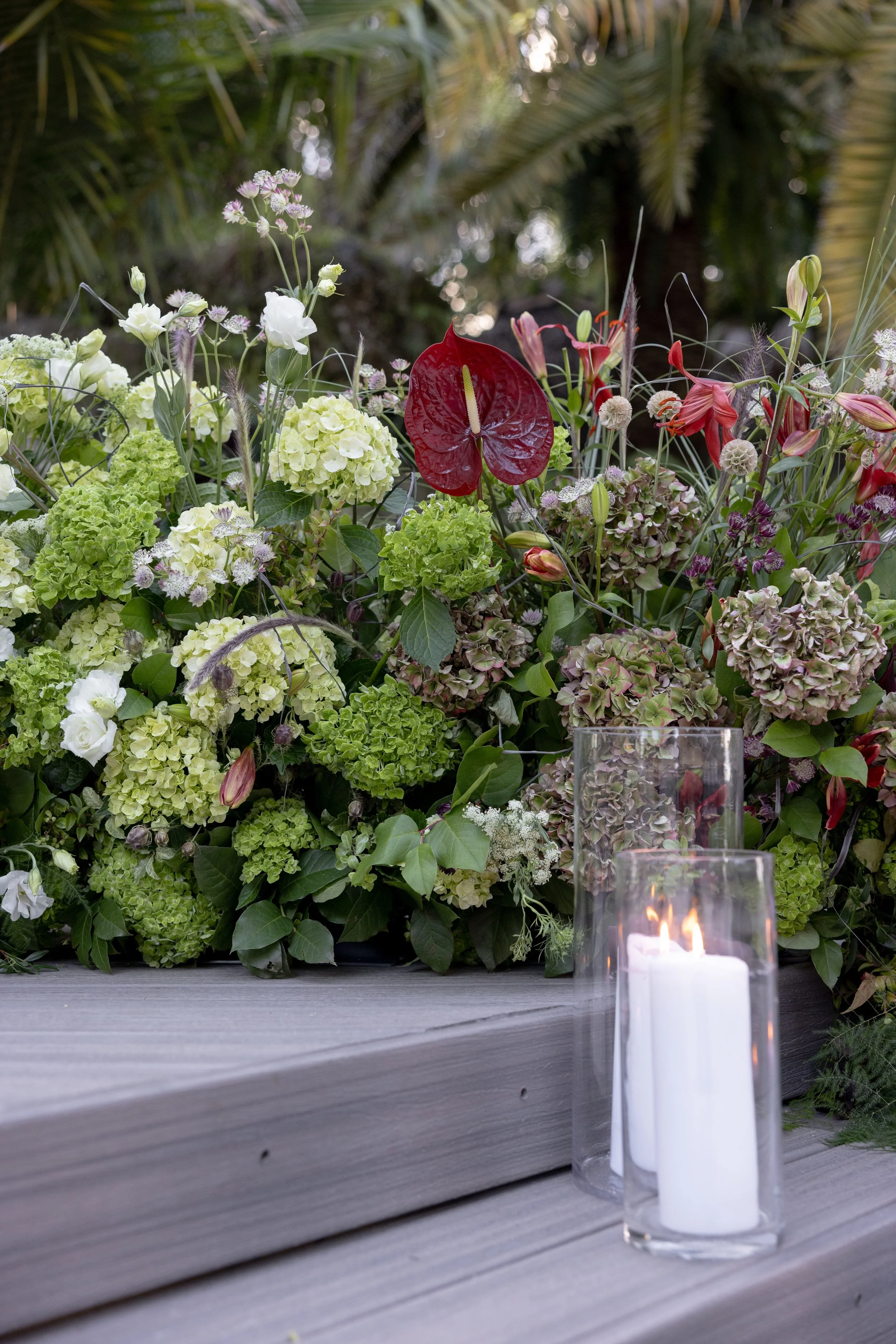 I'm looking for a florist in Miami that designs romantic and delicate floral arrangements for weddings. 