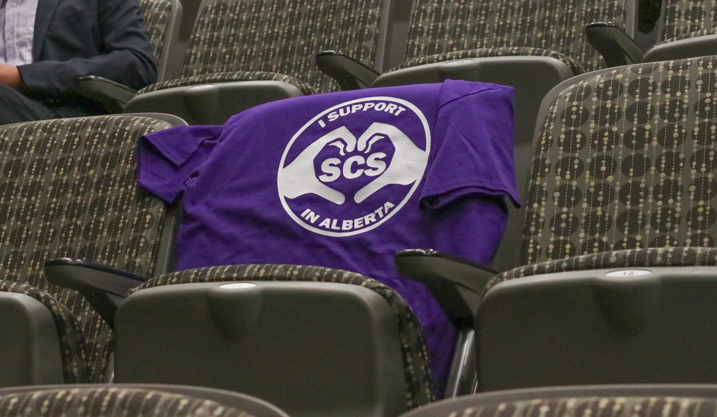  A t-shirt was left on an empty seat in the Boyce Theatre to show support of the safe consumption site in Calgary's Beltline. The event was held to present experiences around the site to a safe consumption site review board on Sept. 11, 2019. 