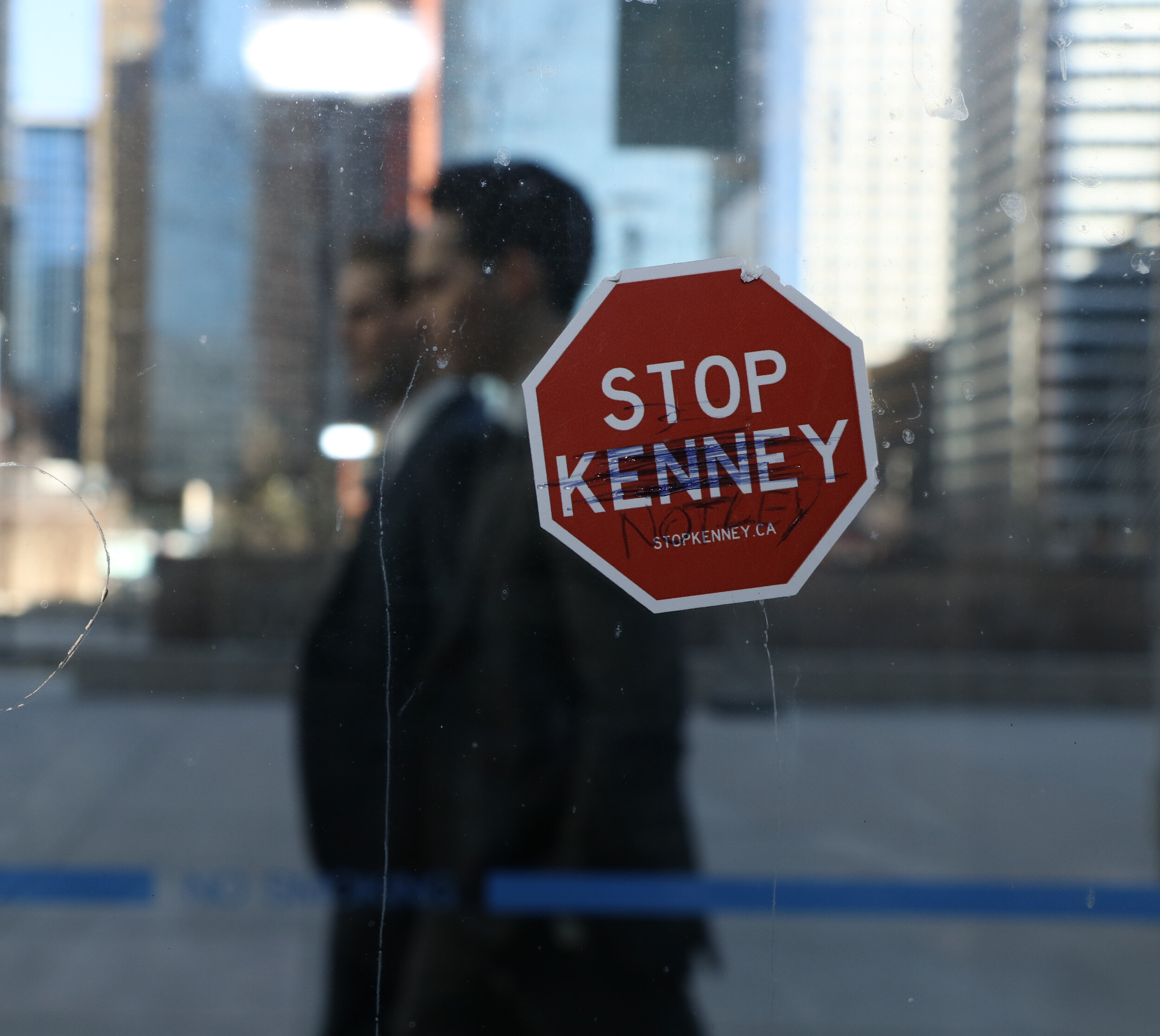  Political protest sticker are common on bus shelters in the core, like this one at the 4th Street C-Train station, in downtown Calgary on Monday, April 8, 2019. The provincial election is on April 16, 2019. 