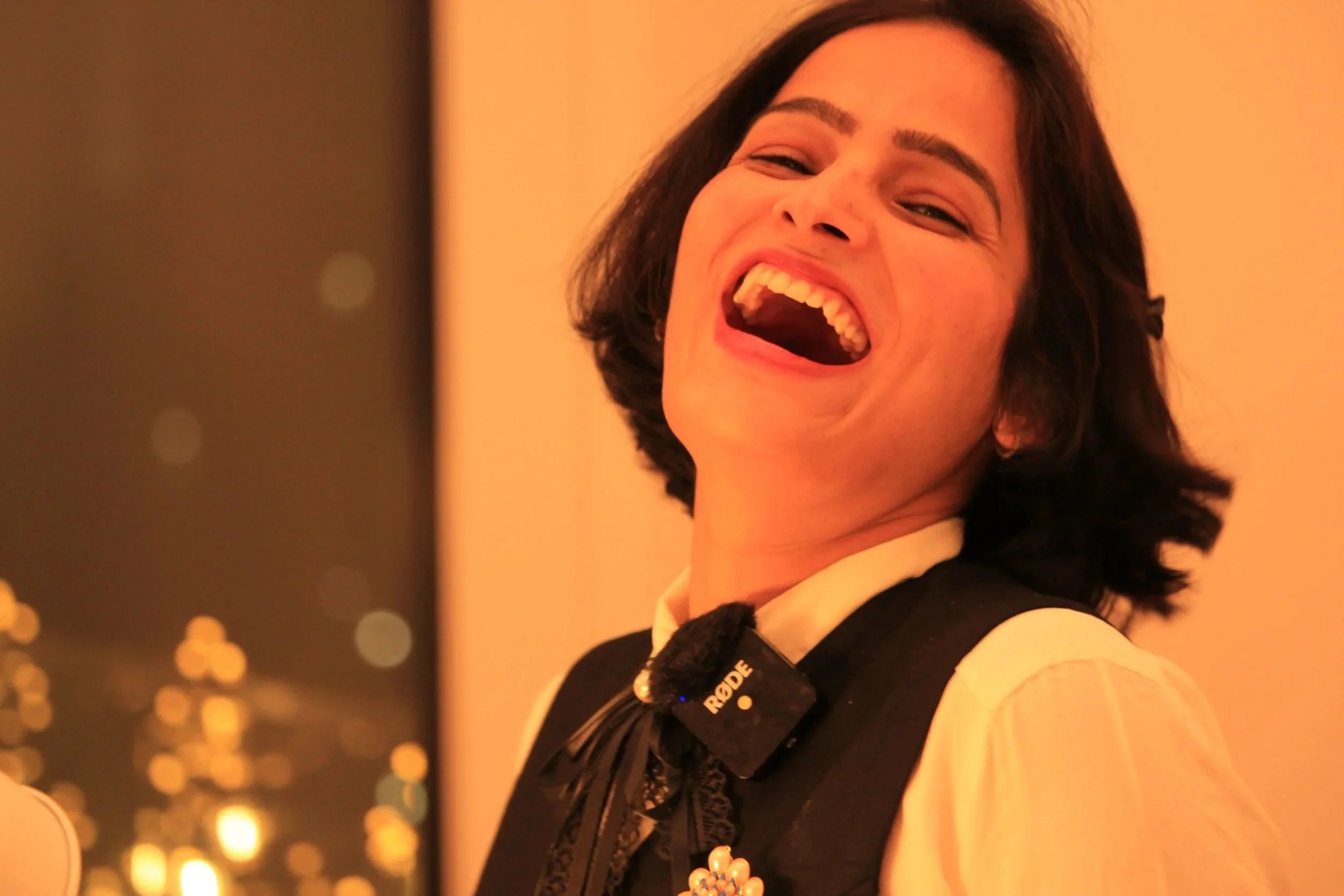 Nistha Trehun, certified Laughter Yoga leader, laughing during a laughter yoga workshop for teams in Berlin