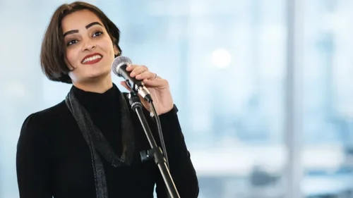 Nistha Trehun speaking with a microphone