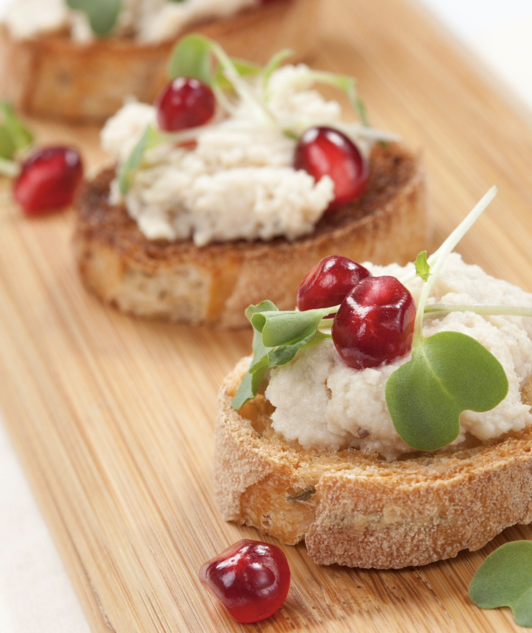 WHITE BEAN CROSTINI WITH POMEGRANATE &amp; MINT