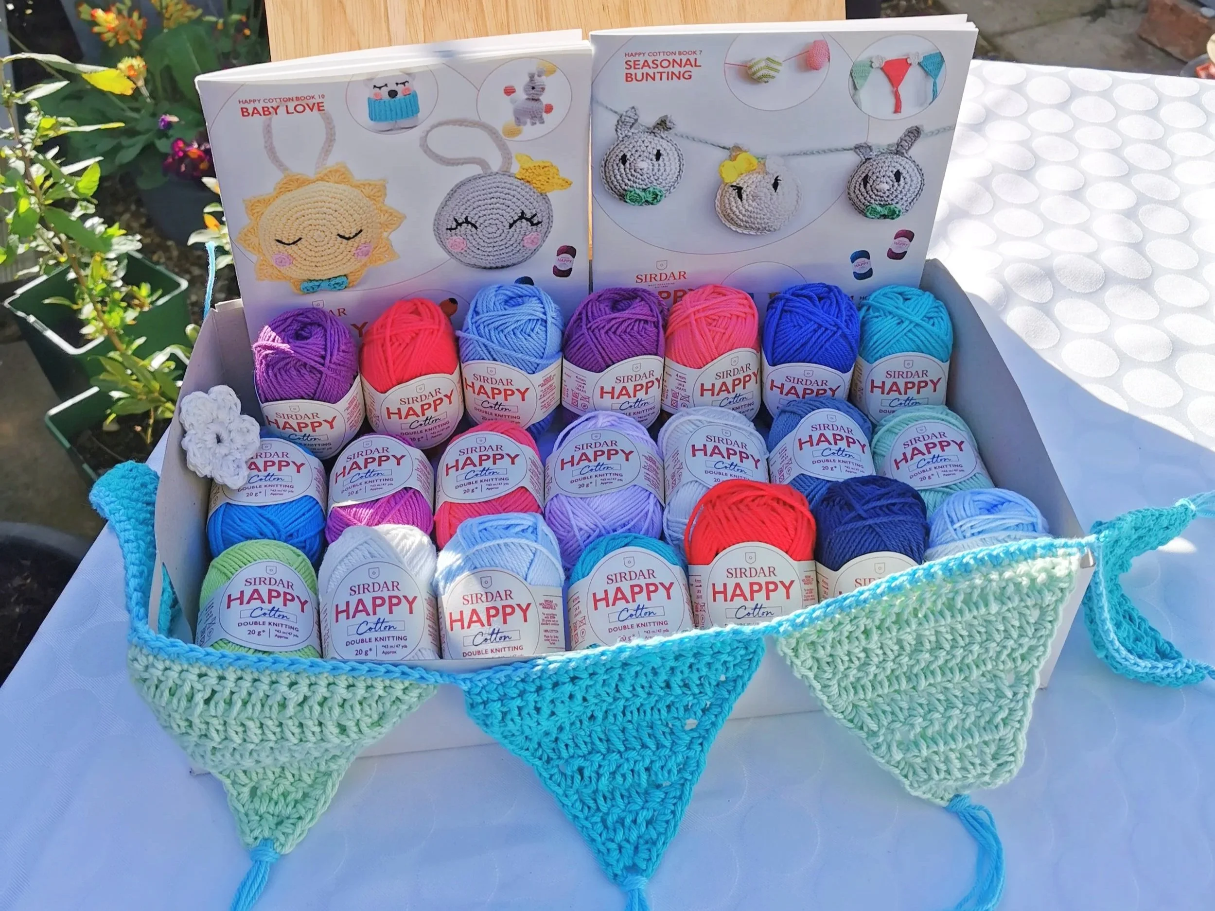 Happy Cotton summer display with crochet bunting