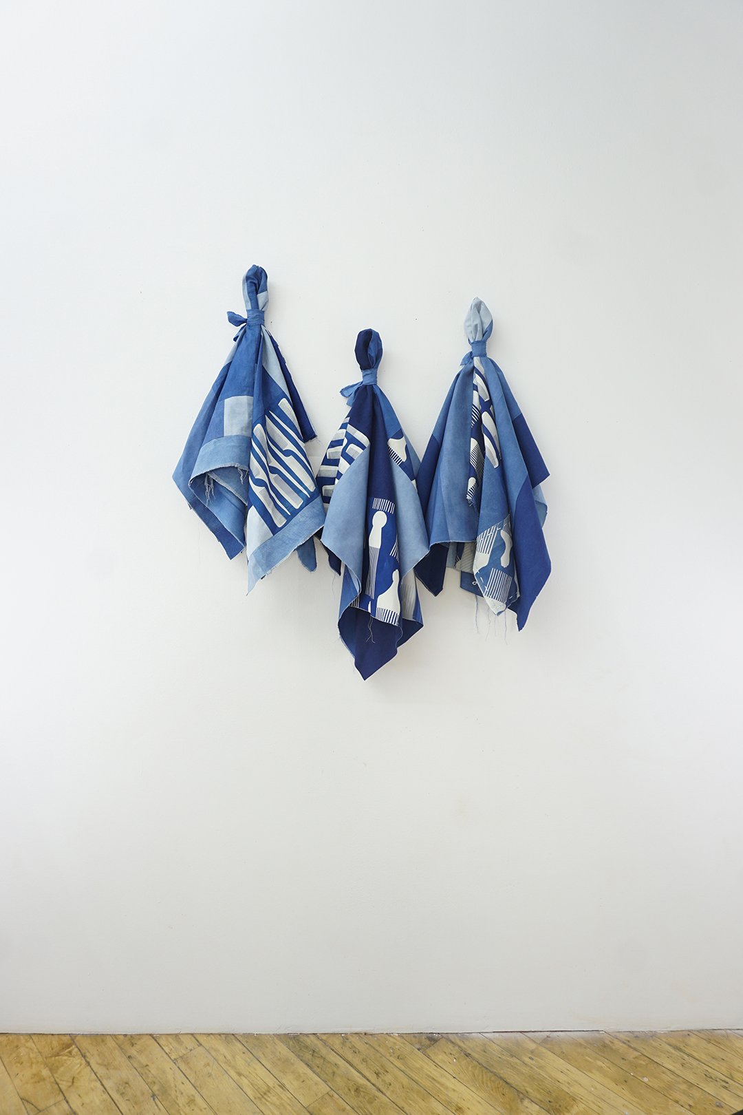 free the quiet voice from the sea (2023) - Hand-dyed indigo cotton cloth and combs printed on cyanotype machine pieced into quilt tops with hand-stitched details.