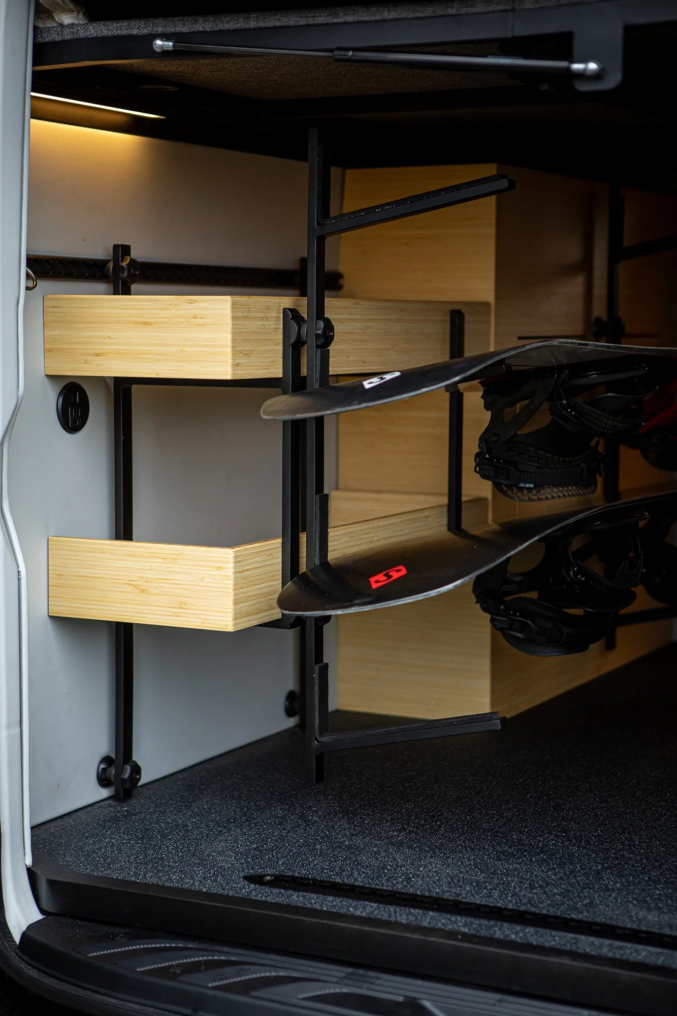 EAV Zephyr Adventure Van's under-bed storage area.