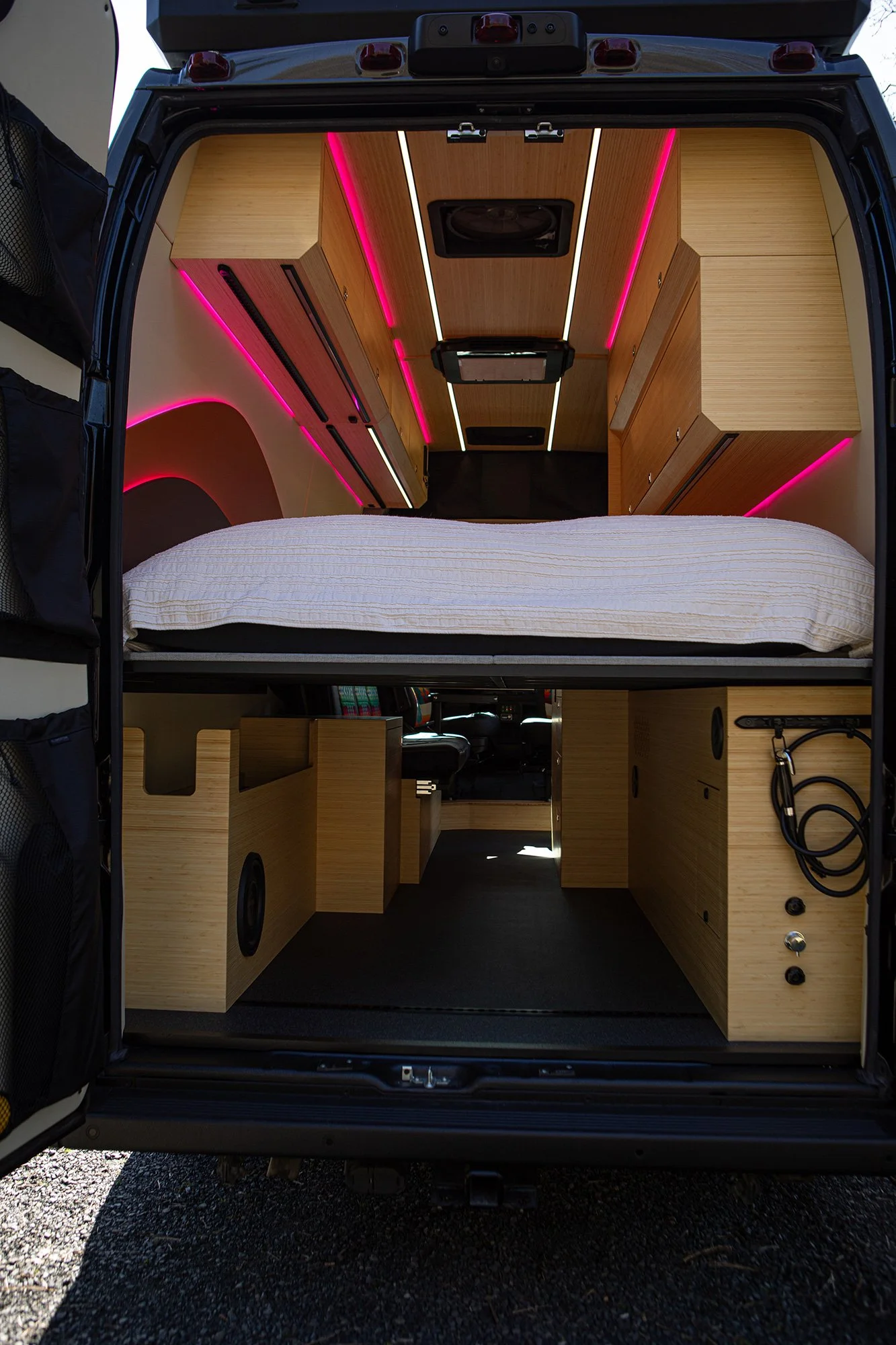 Cosmicc's bed area with storage below.