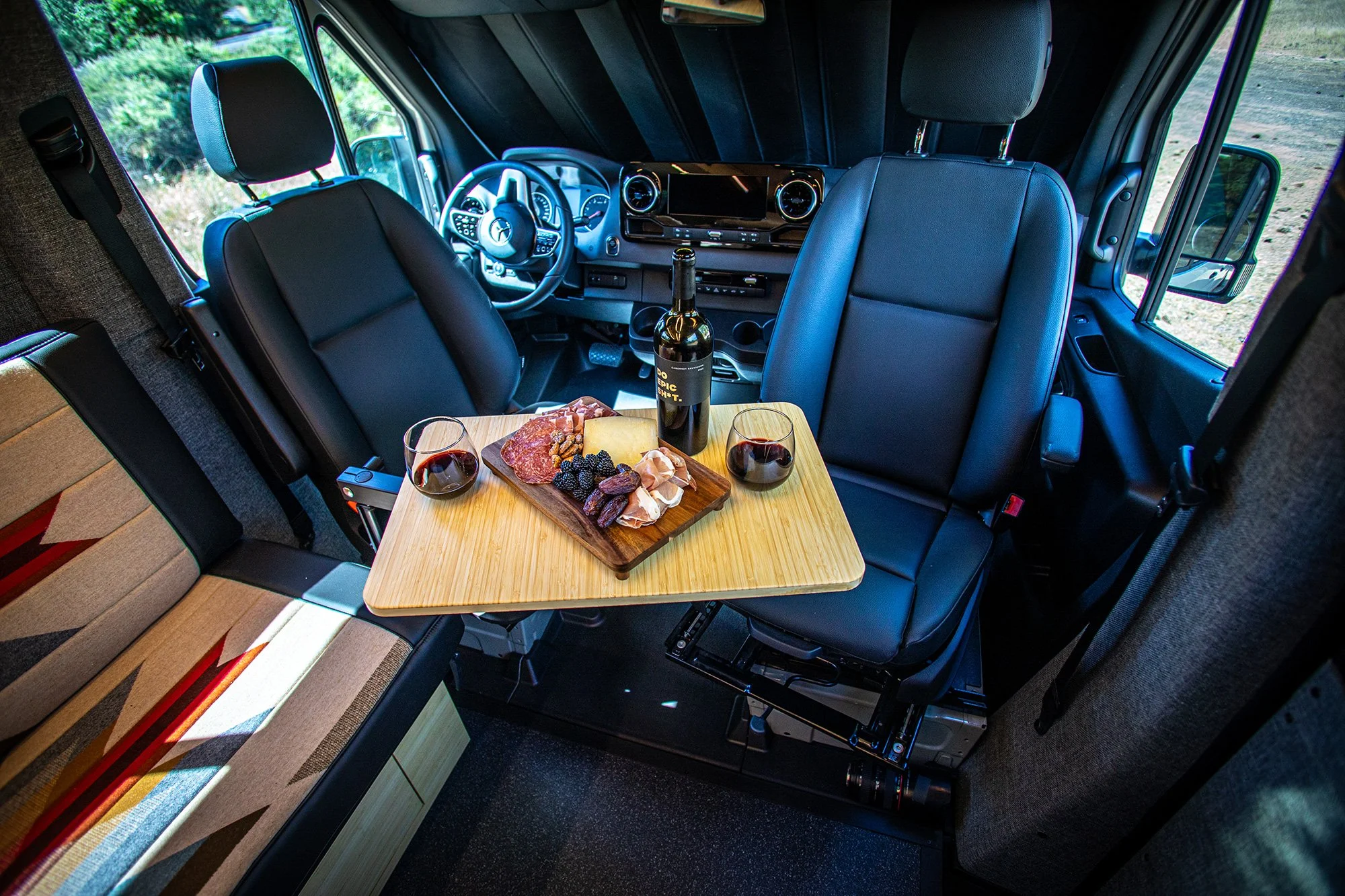 EAV Zahra Adventure Van's Interior with charcuterie board.