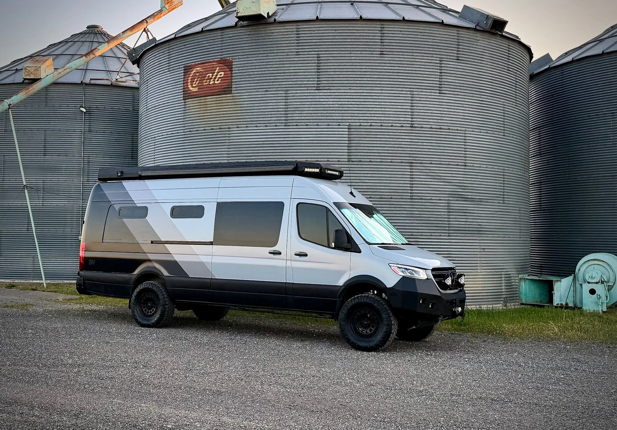 EAV Wolf Adventure Van exterior right side in front of grain silos