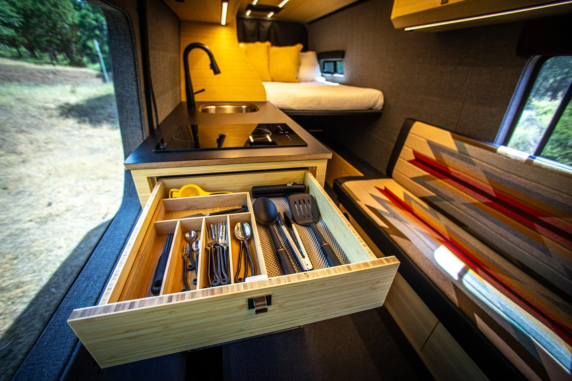 EAV Zahra Adventure Van's kitchen & Bed setup.