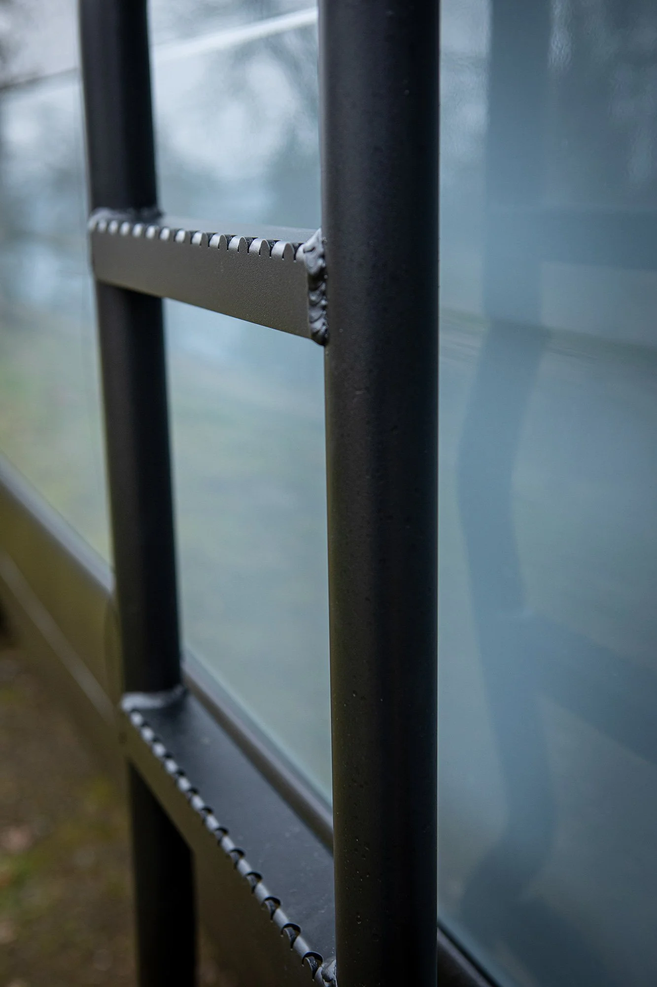 EAV Zephyr Adventure Van's exterior ladder.