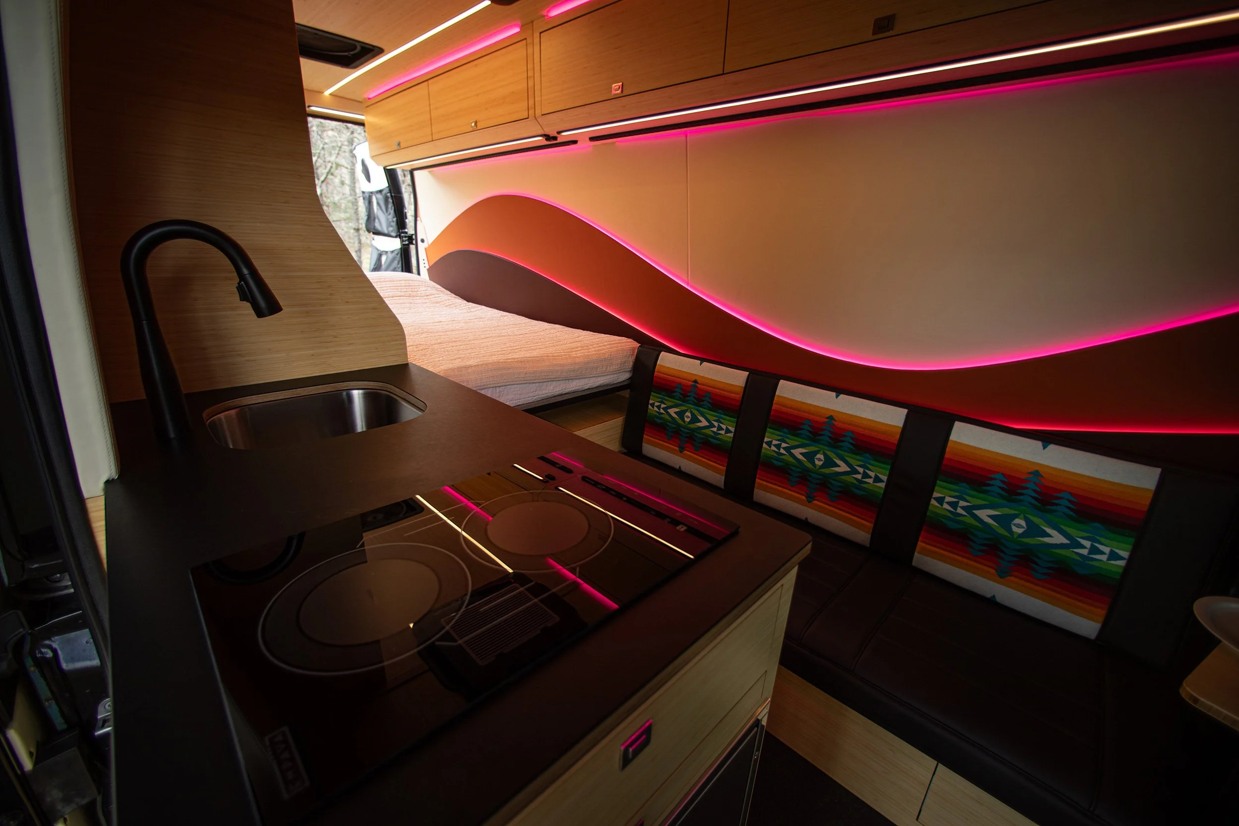 Cosmicc adventure van's interior with bed down.