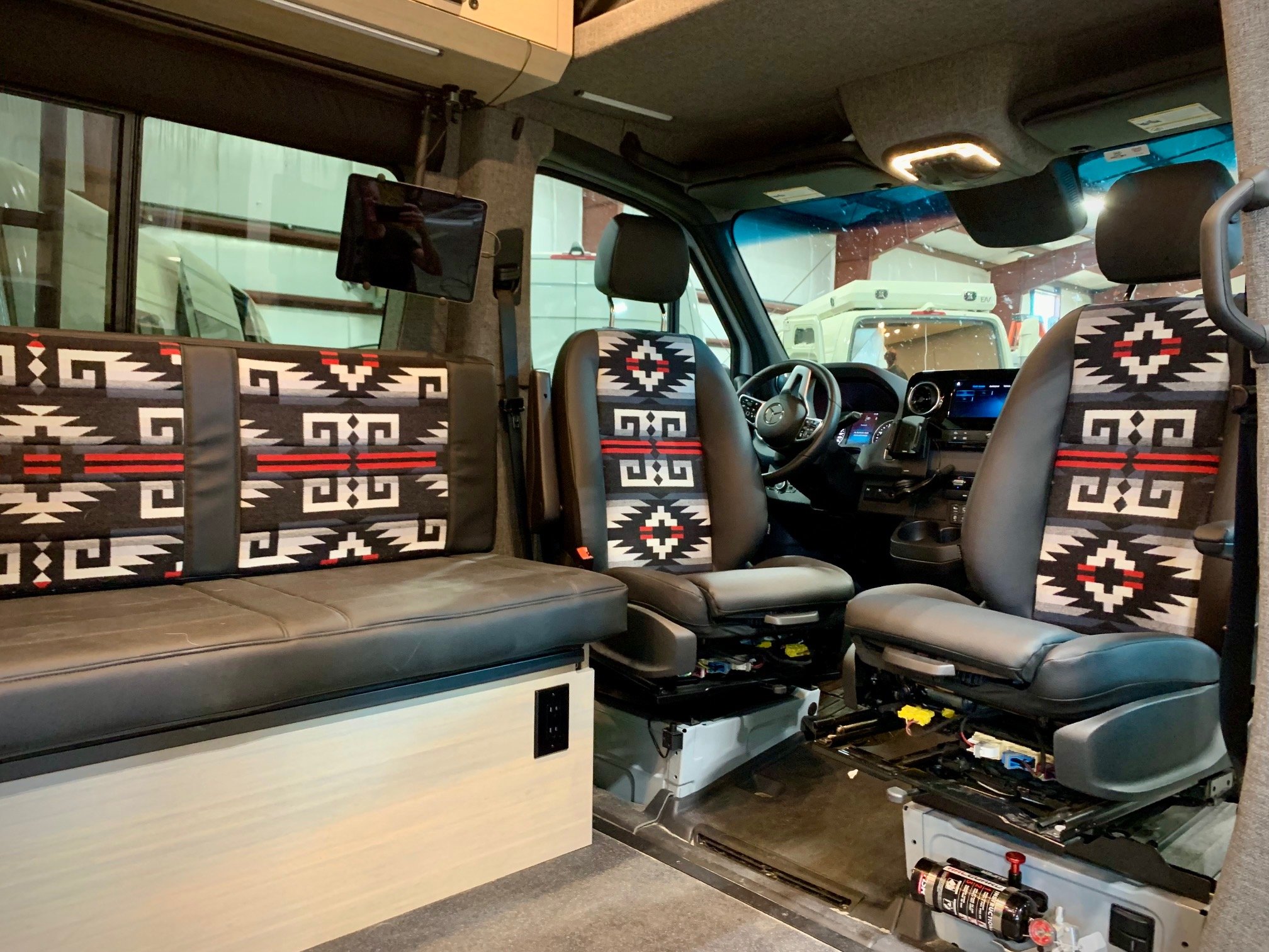 EAV Wolf Adventure Van's interior seating arrangement.