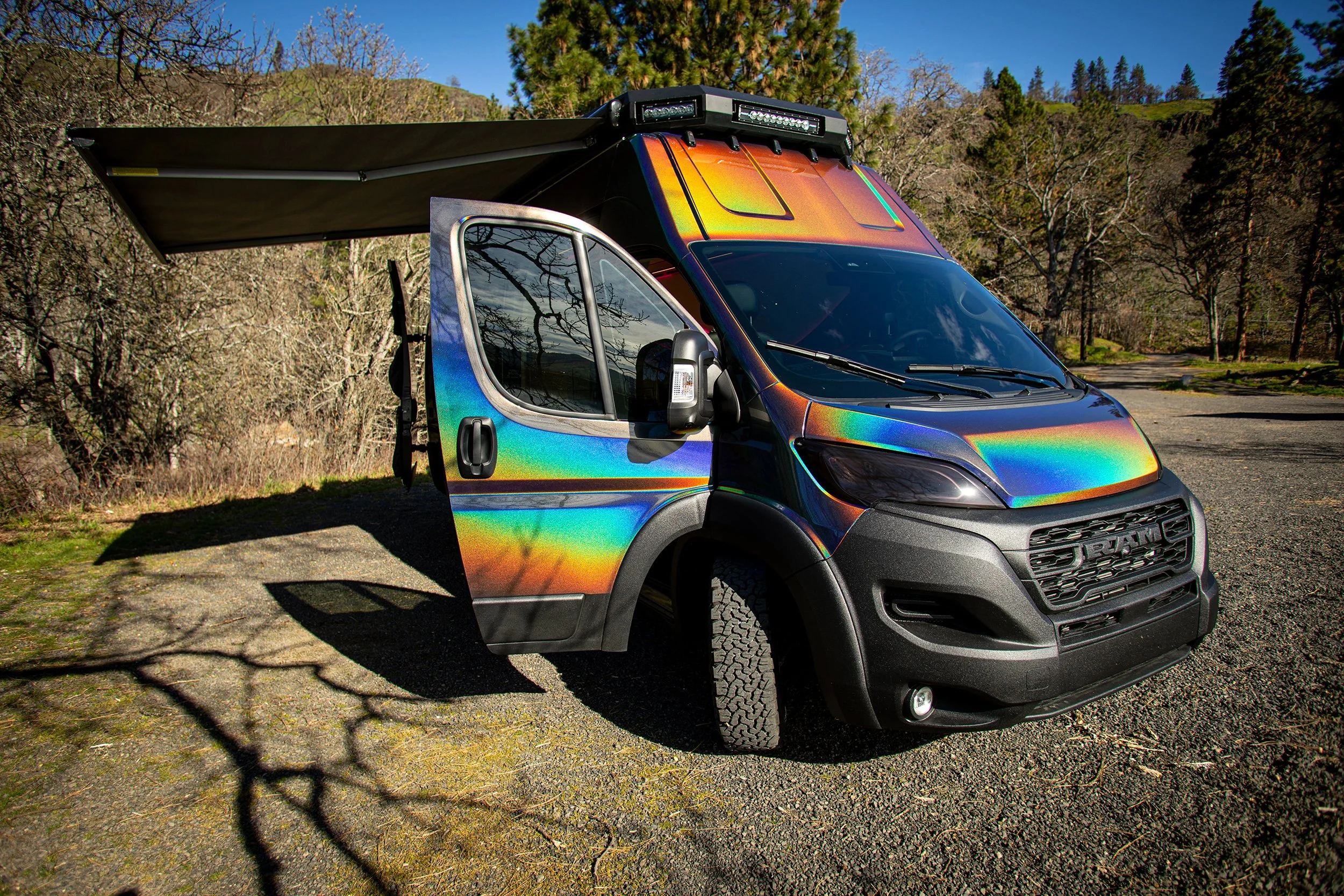 Cosmicc Adventure Van's exterior with awning open.