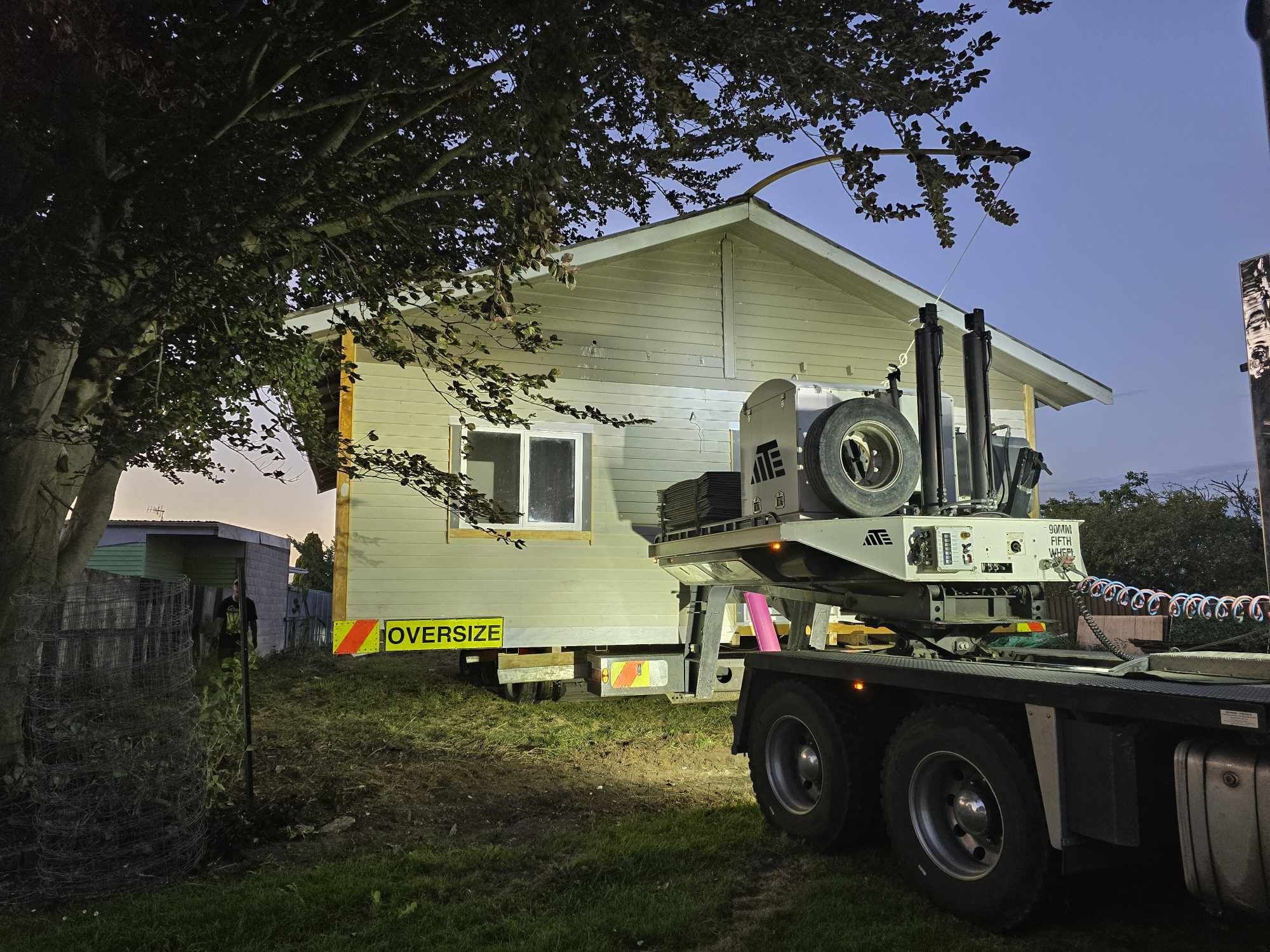 weatherboard house on truck.
