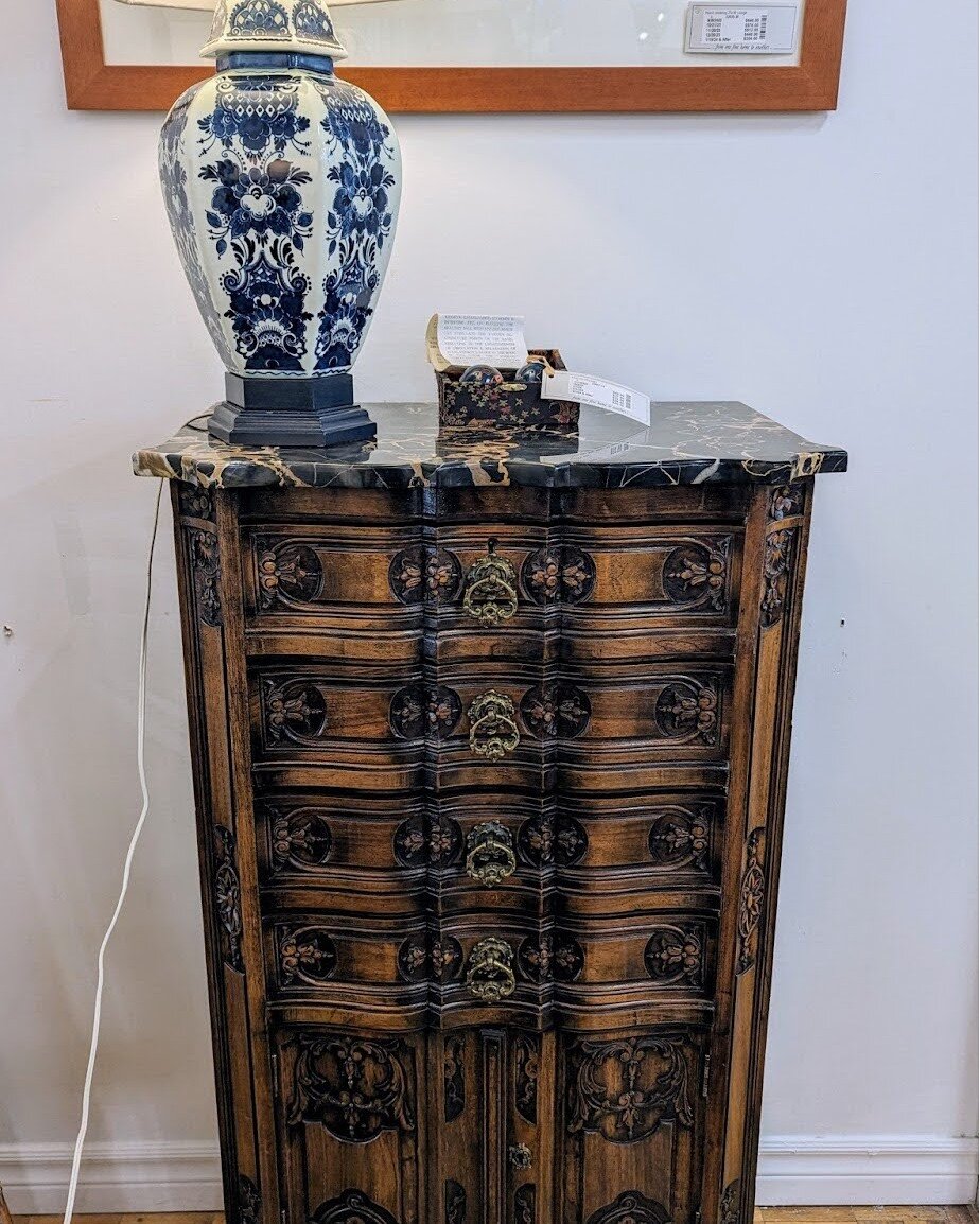 Embrace old world elegance with this distinctive chest. 

This piece not only captivates with its sophisticated appearance but also offers practicality with ample storage space. Display this character-rich piece in your living room for added storage 
