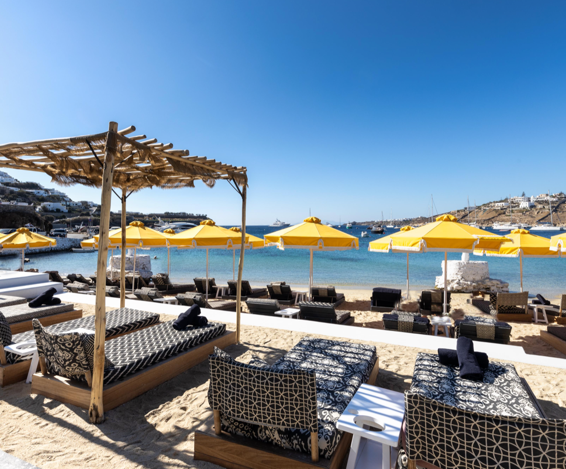 Mykonos Blanc lounges on beach .png