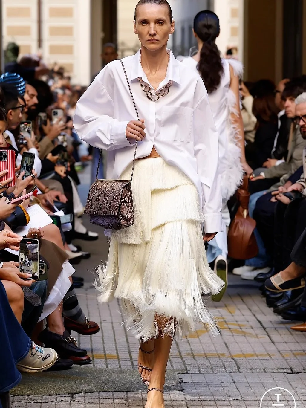 Masculine and feminine pieces mixed in the most interesting ways &mdash; one of the key trends for Spring 2026.

We saw sweatshirts with skirts, suits with ties, button-down shirts worn in unexpected ways, and delicate lingerie-inspired pieces styled