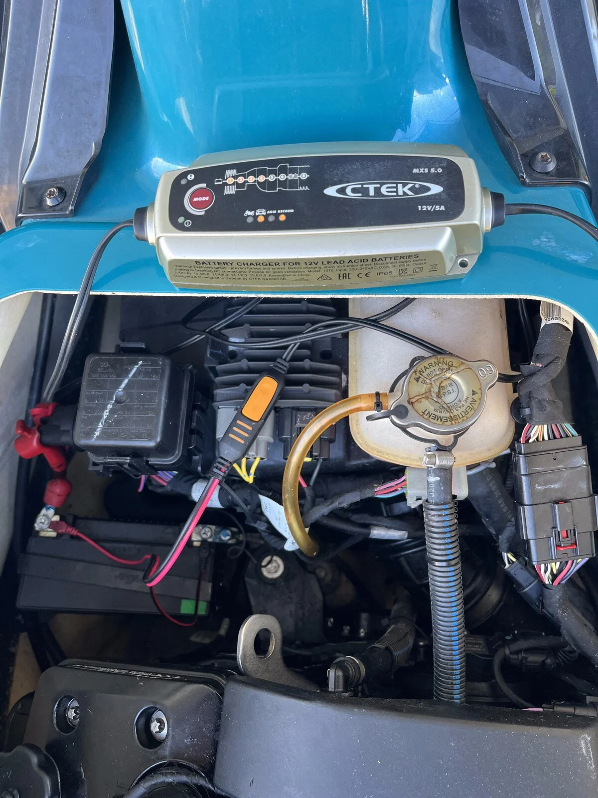 CTEK smart charger wired in to a Sea-Doo battery tender-style, showing amp rating and monitoring