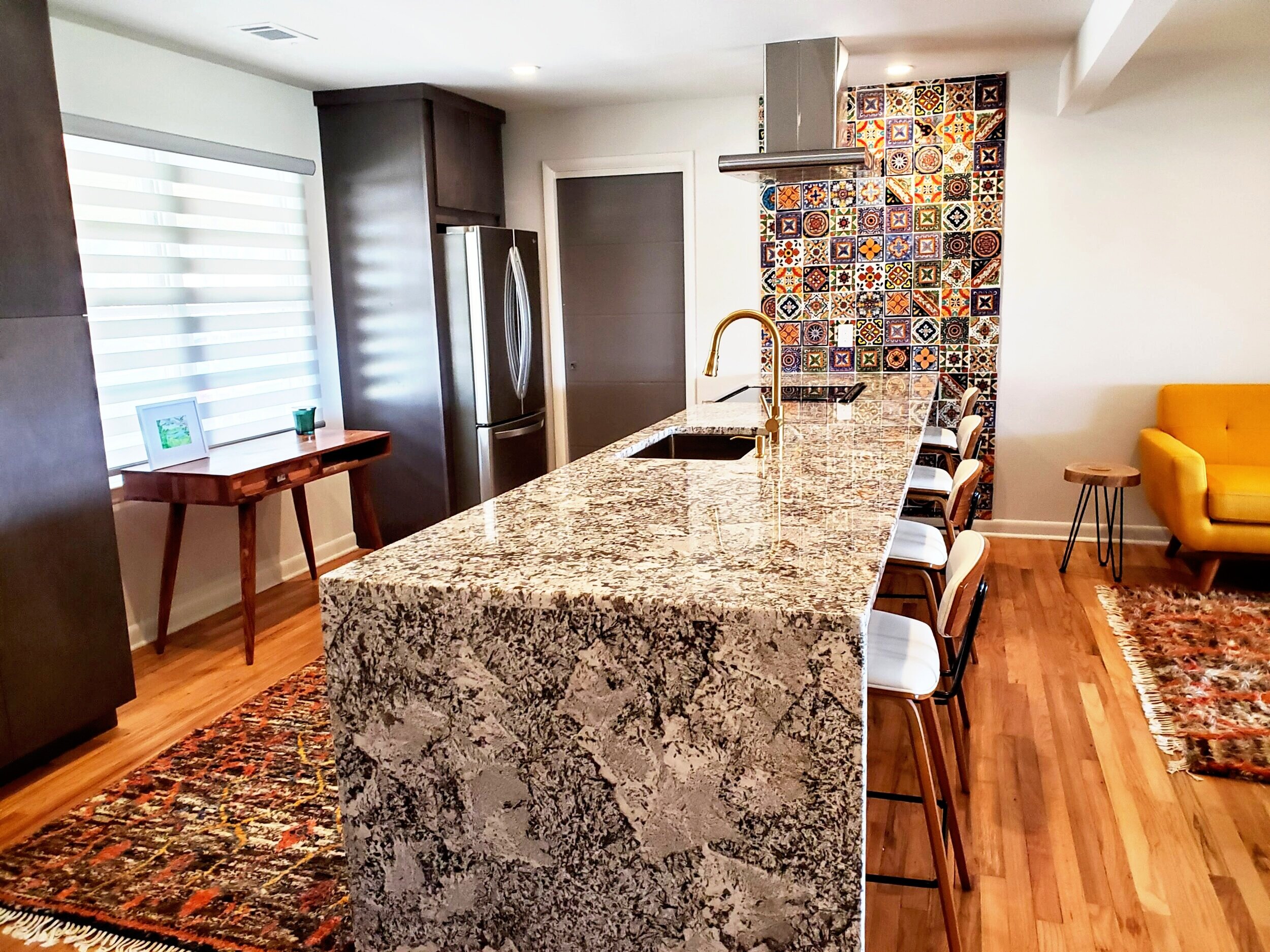 New kitchen peninsula and tile accent wall