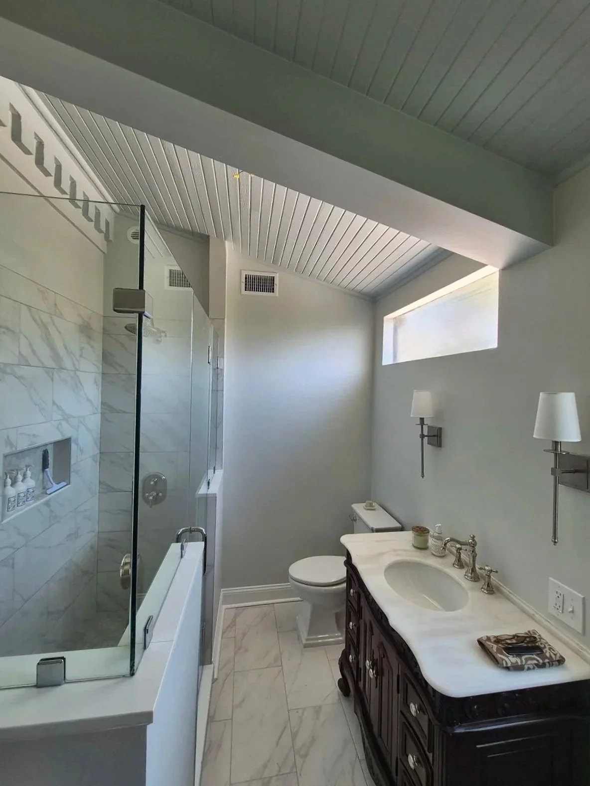 A contemporary, well-appointed primary bathroom designed for a historic residence
