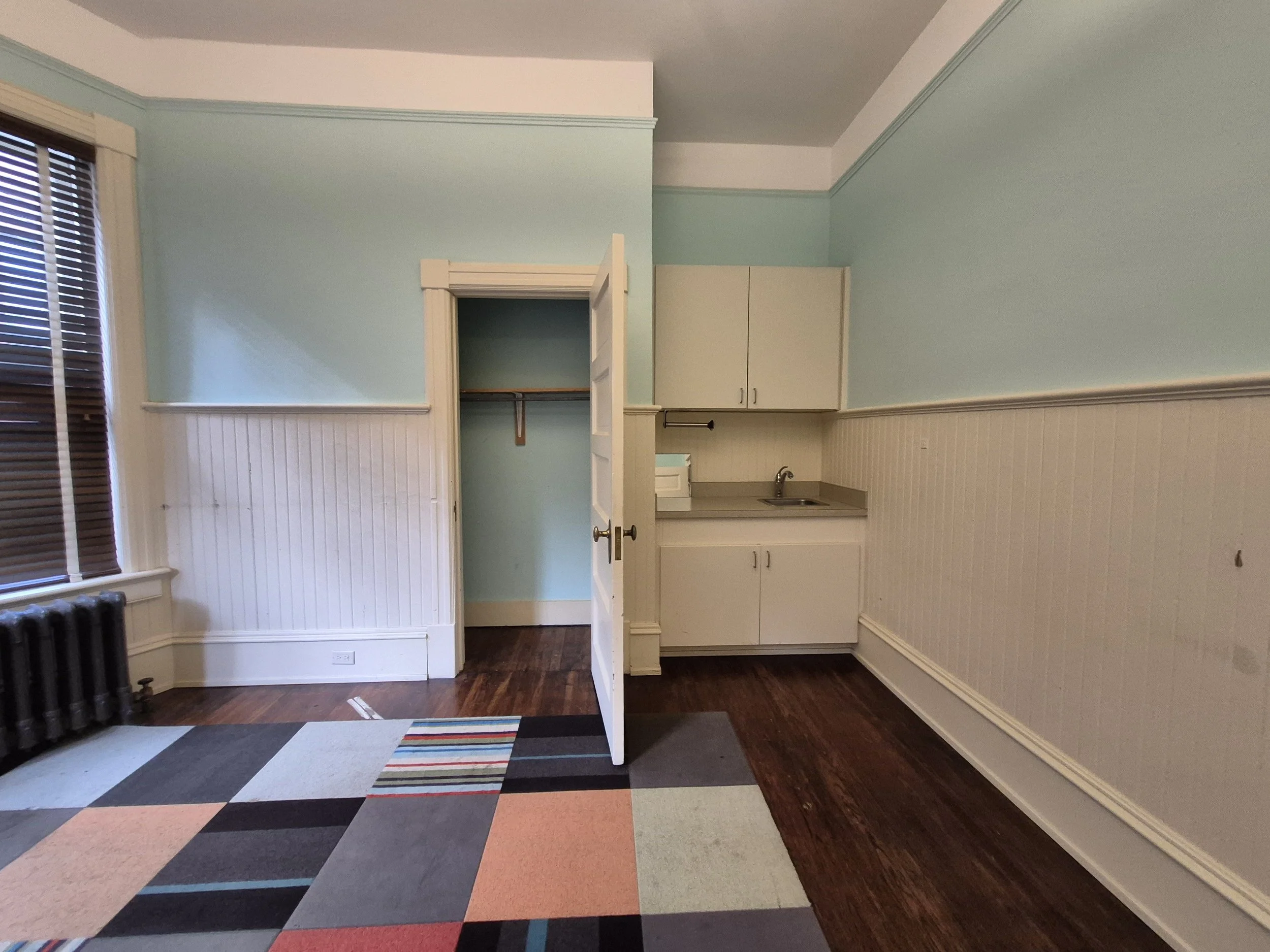 A sink and non-period beadboard wainscot