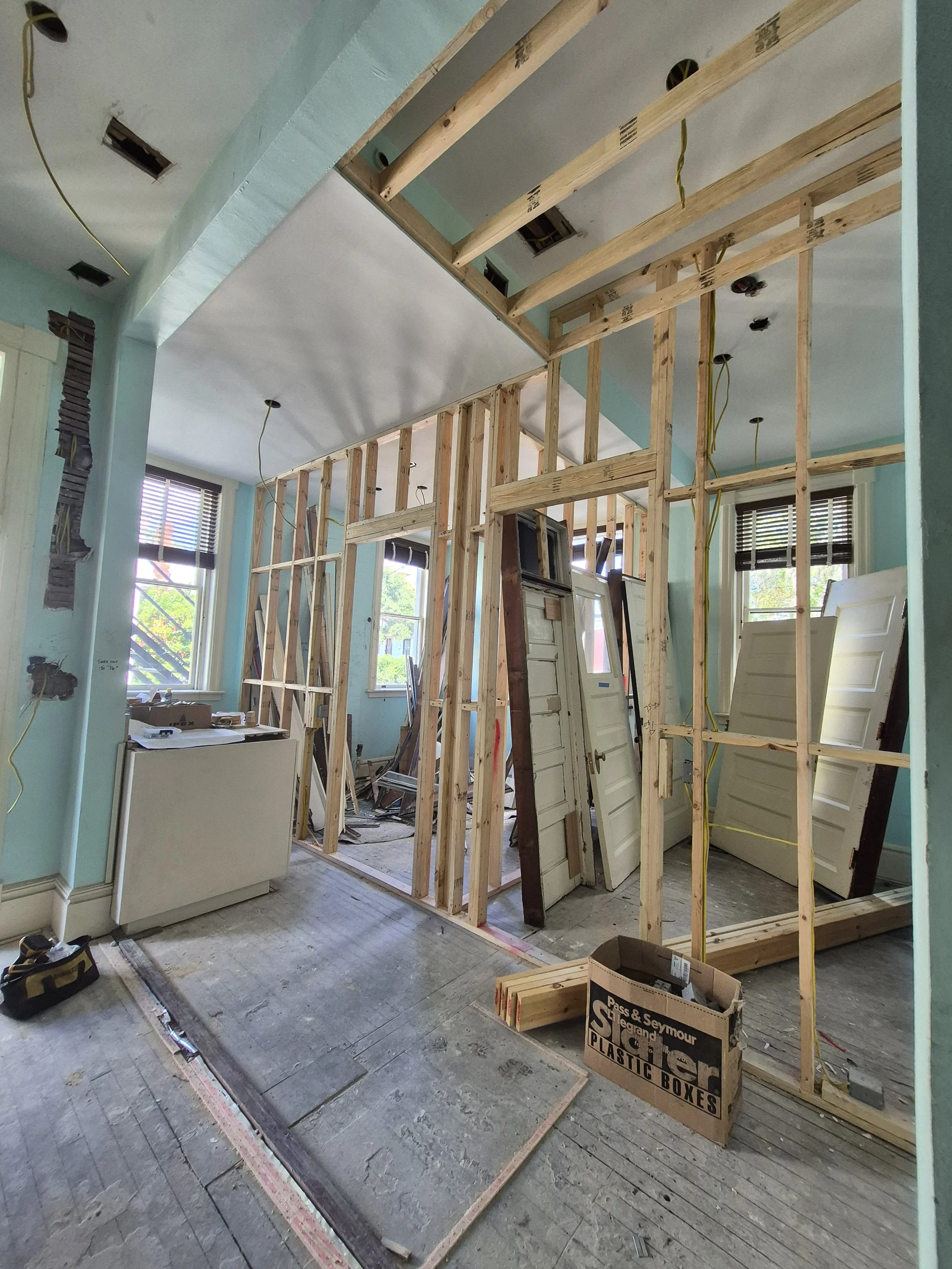 New walls and stored doors for reuse
