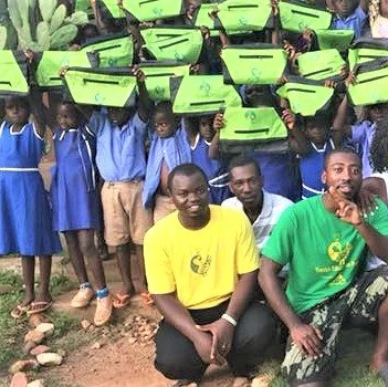 kwa_peace sign with children group.jpg