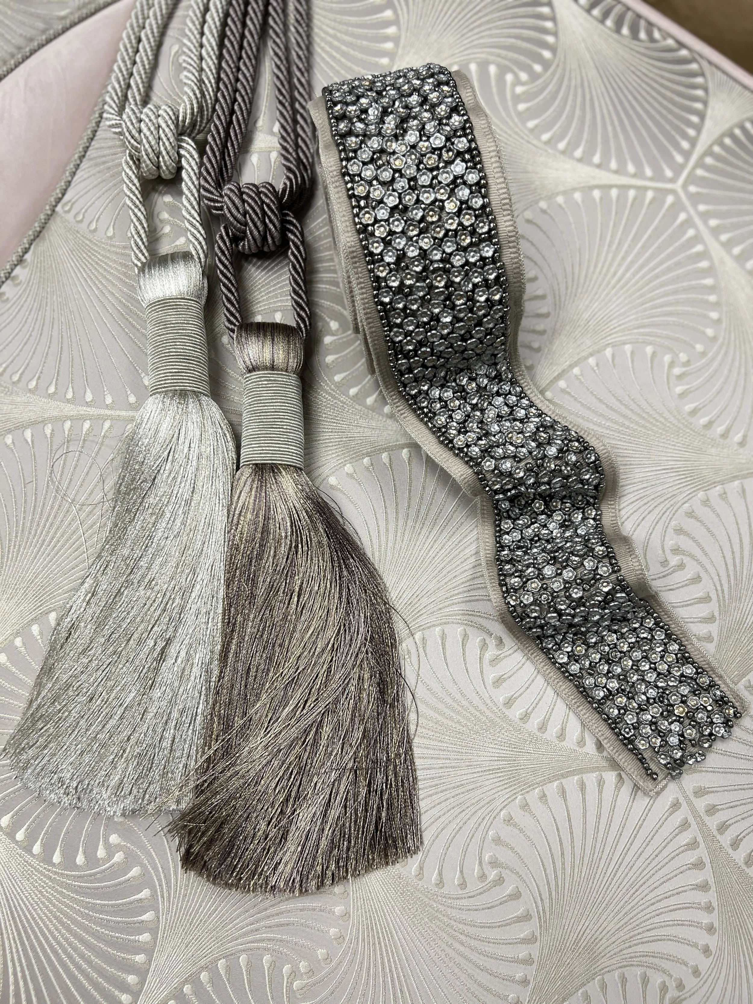 Silver and taupe tassel tiebacks with jeweled trim banding, selected for custom drapery by LUXYSPACE