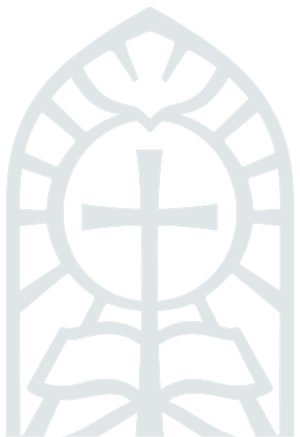A stained glass window with a cross and an open book at the bottom.