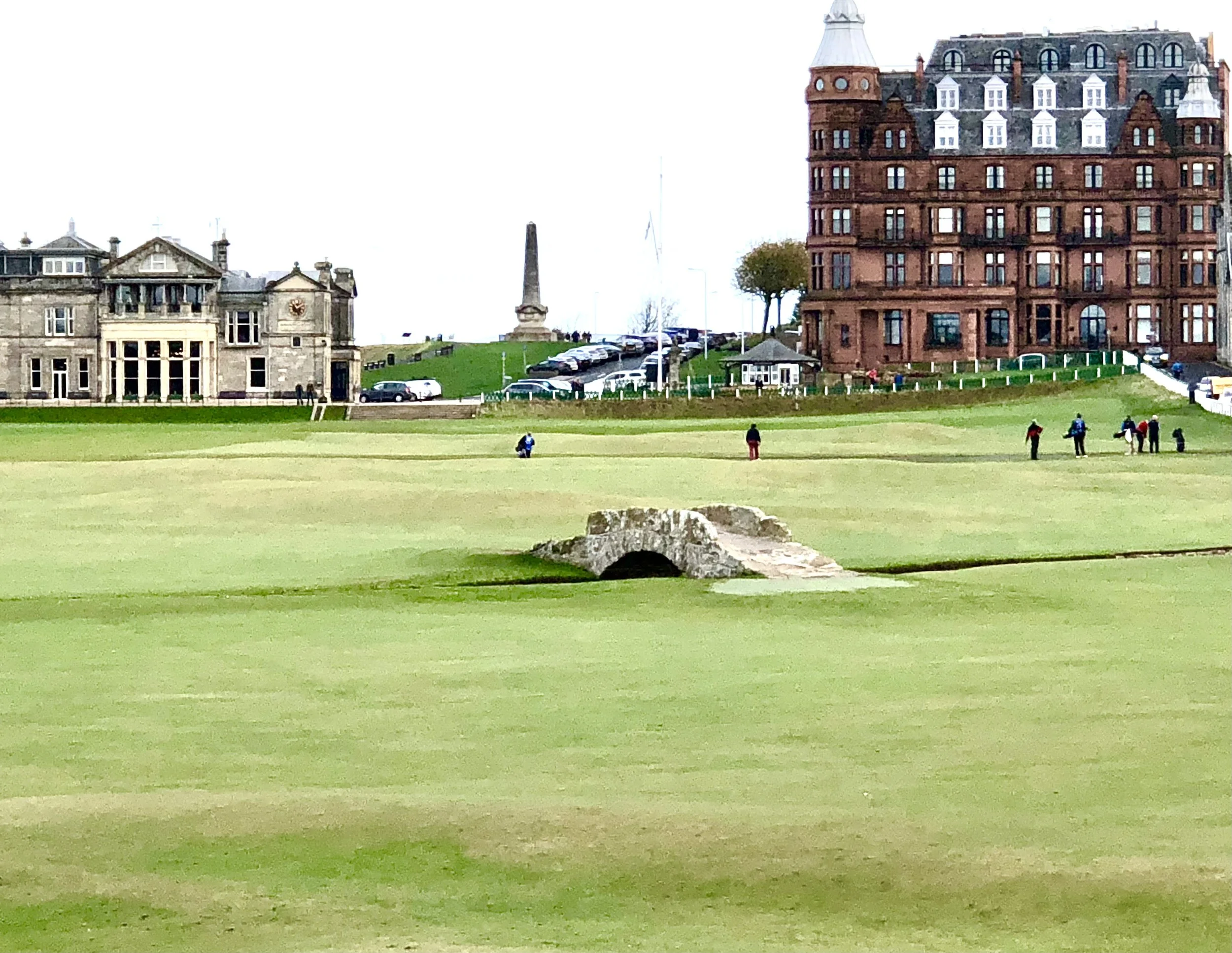 Last hole at St Andrews Old Course R&A Clubhouse to the left With Hamilton Grand building to the back of the green