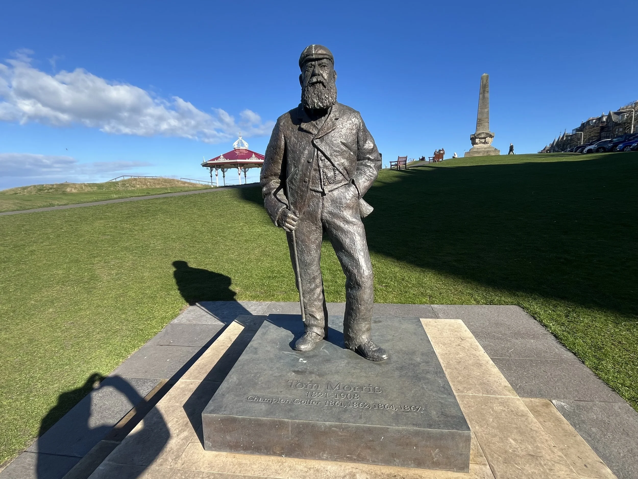 Statue of Old Tom Morris Champion golfer and keeper of the green, the statue in behind the 18th green at St Andrews old course.