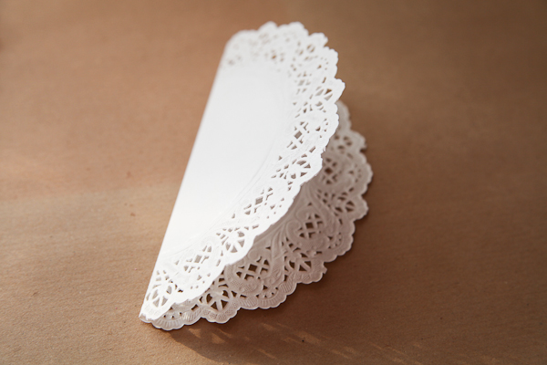 3. Cut all your doilies along the fold line - Creating half doilies