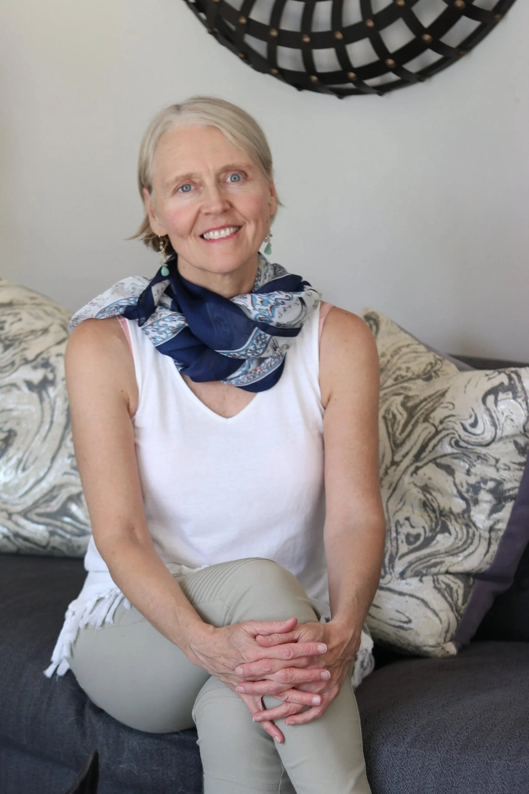 transformational life coach Rebecca Saxon sitting on a sofa in St-Louis