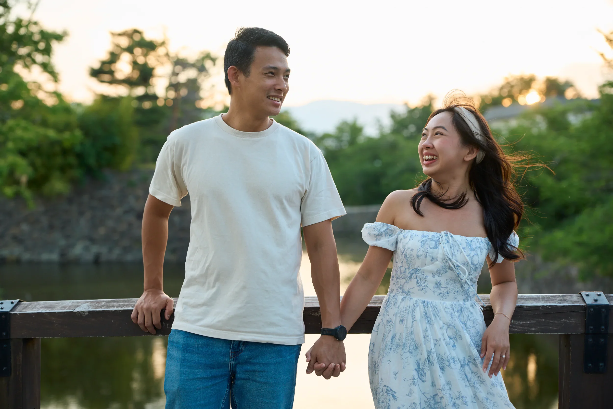 Newly engaged couple posing together in front of Matsumoto Castle, Nagano