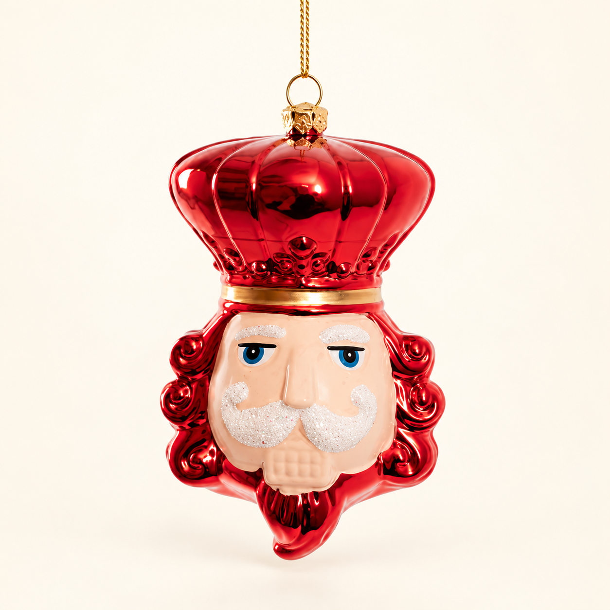 Single red nutcracker head ornament.png