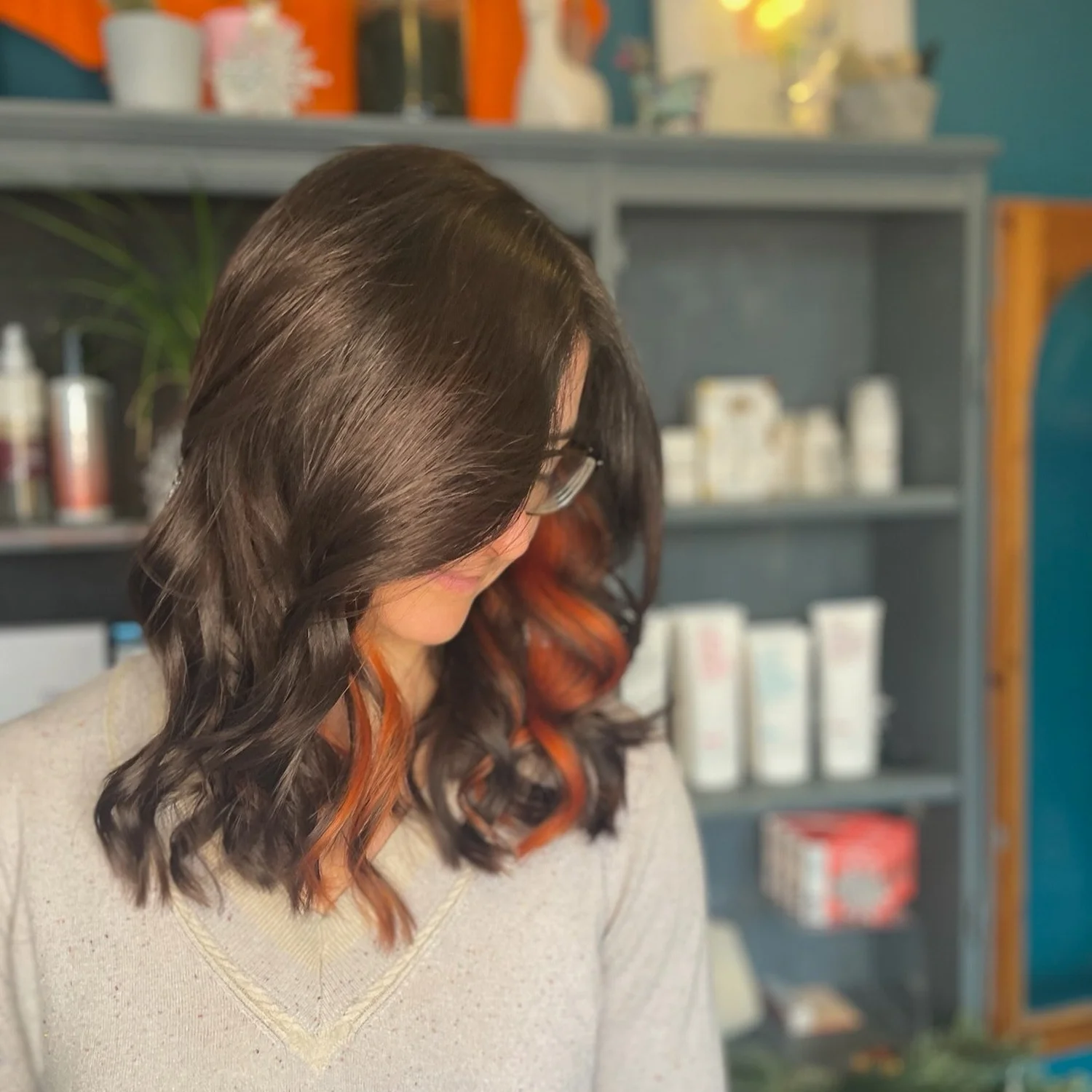 Glossy brunette hair with copper face-framing colour at JamesB Hair in Bristol.