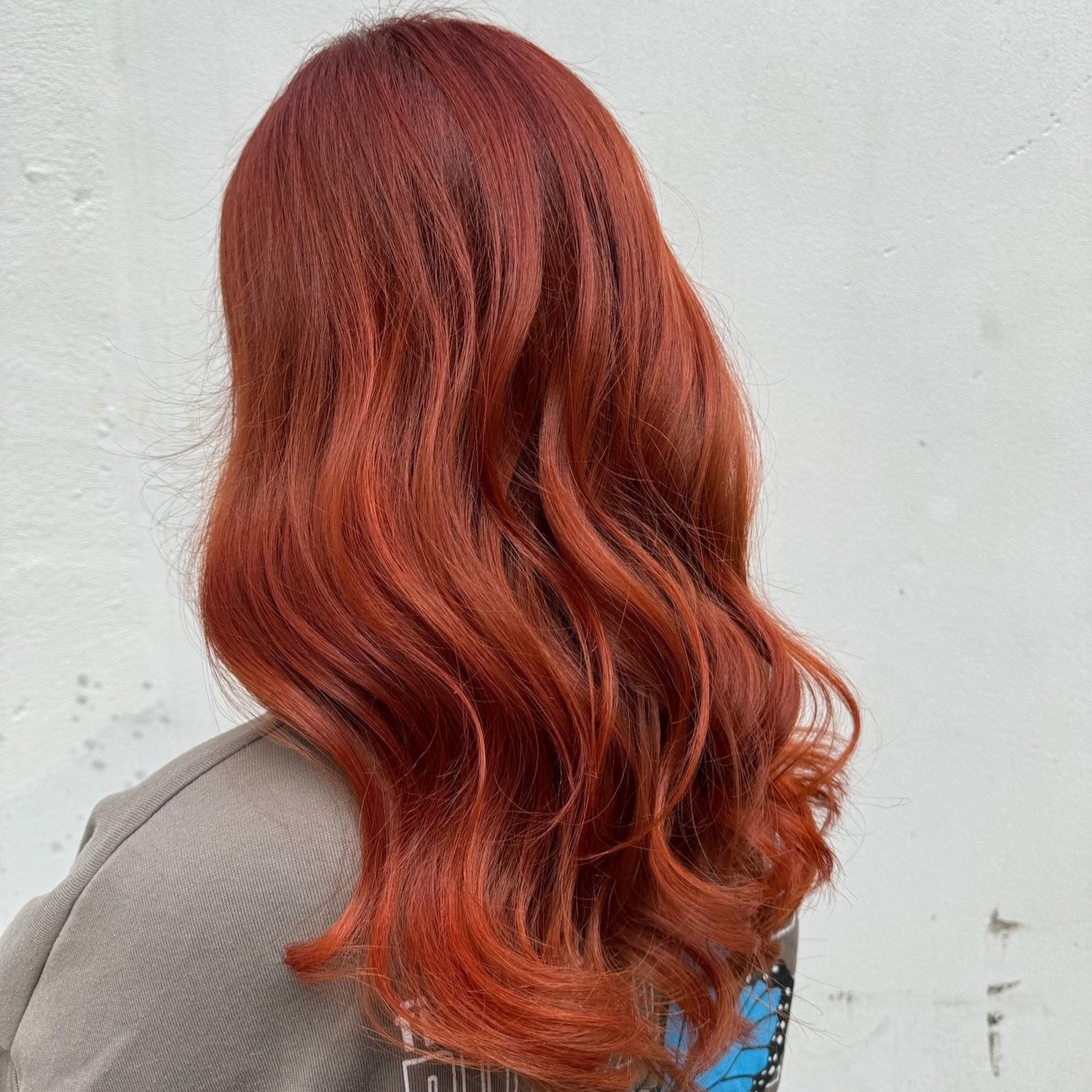 Glossy copper hair colour result created at JamesB Hair in Bristol.
