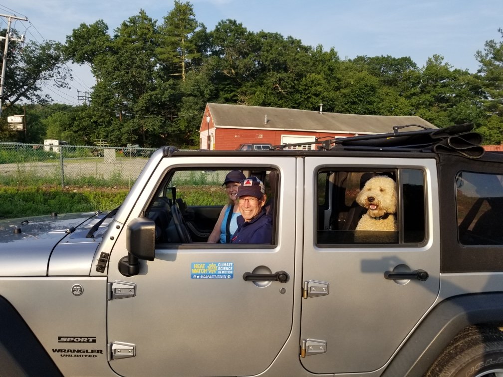 Heat Watch Volunteers in their car and a dog in the back seat