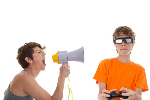 woman_shouting_at_a_boy_playing_computer_games.jpeg