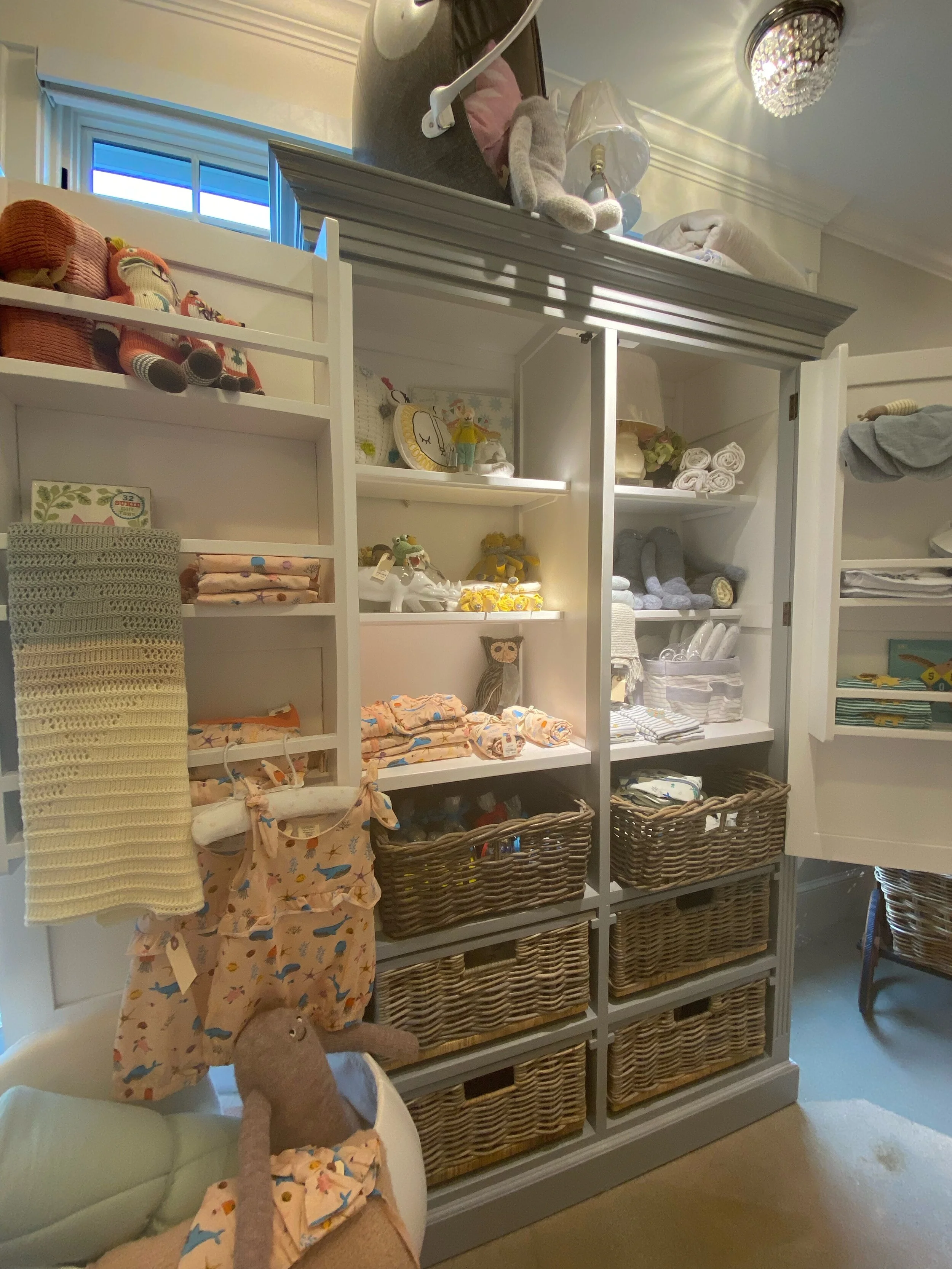 Light Blue Baby Dresser with Rattan Baskets
