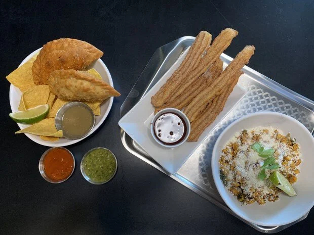 Empanadas, Churros and Grilled Elote Salad from MidNord at Graze Provisions + Libations in Minneapolis’ North Loop. Photographed Sept. 5, 2019. (Nancy Ngo / Pioneer Press)