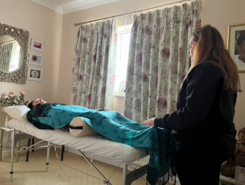 Student giving Reiki in Clacton