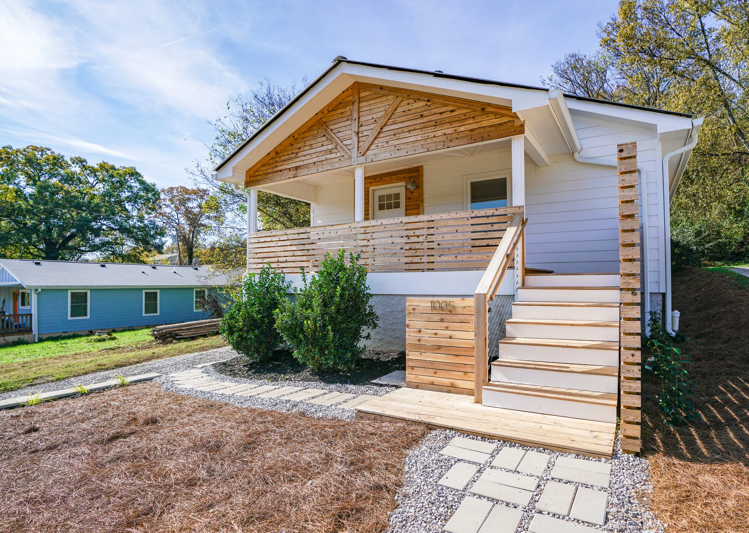  An old north shore Chattanooga house needed a modern face lift. The rich red tones of Cedar become the main accent material that brings new life to this standard form.  